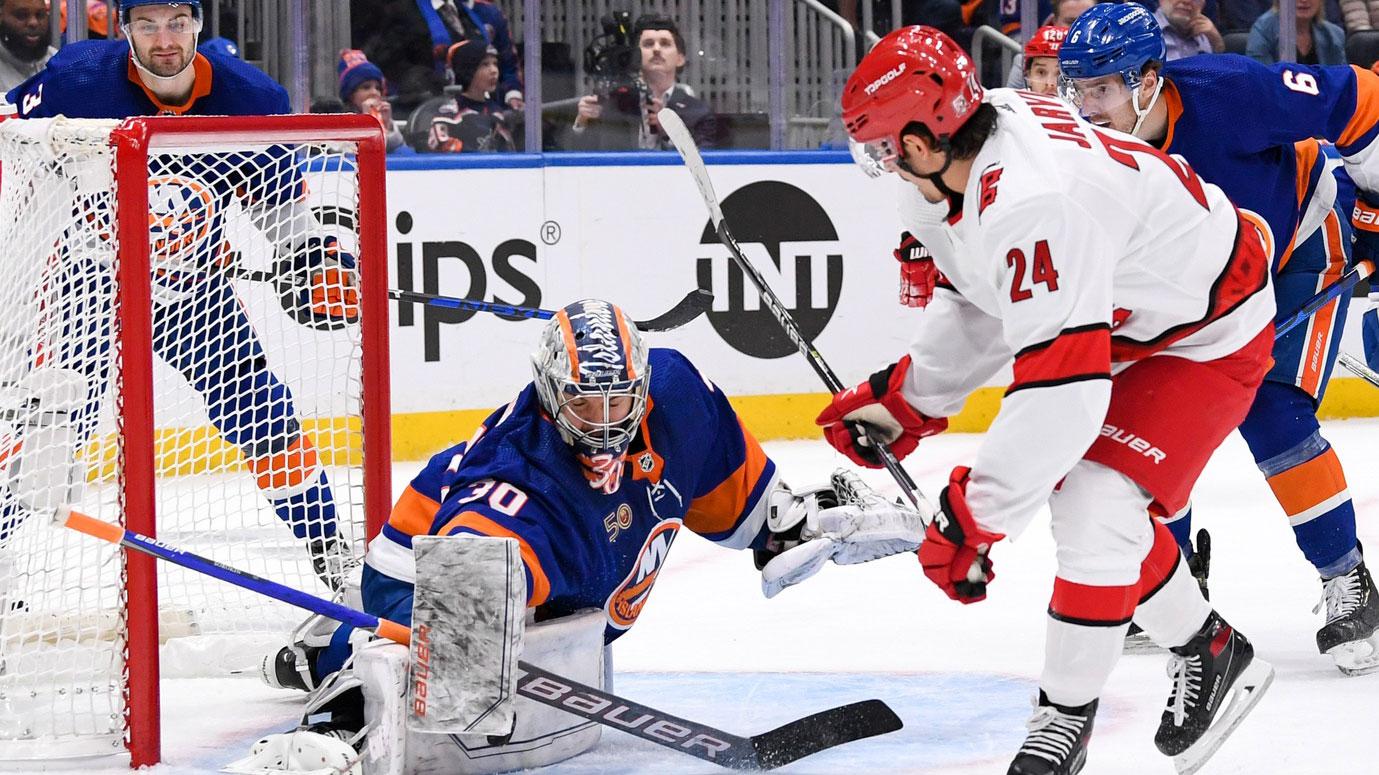 Apr 23, 2023; Elmont, New York, USA; New York Islanders goaltender Ilya Sorokin (30) makes a save on Carolina Hurricanes center Seth Jarvis (24) during the first period in game four of the first round of the 2023 Stanley Cup Playoffs at UBS Arena. / Dennis Schneidler-USA TODAY Sports