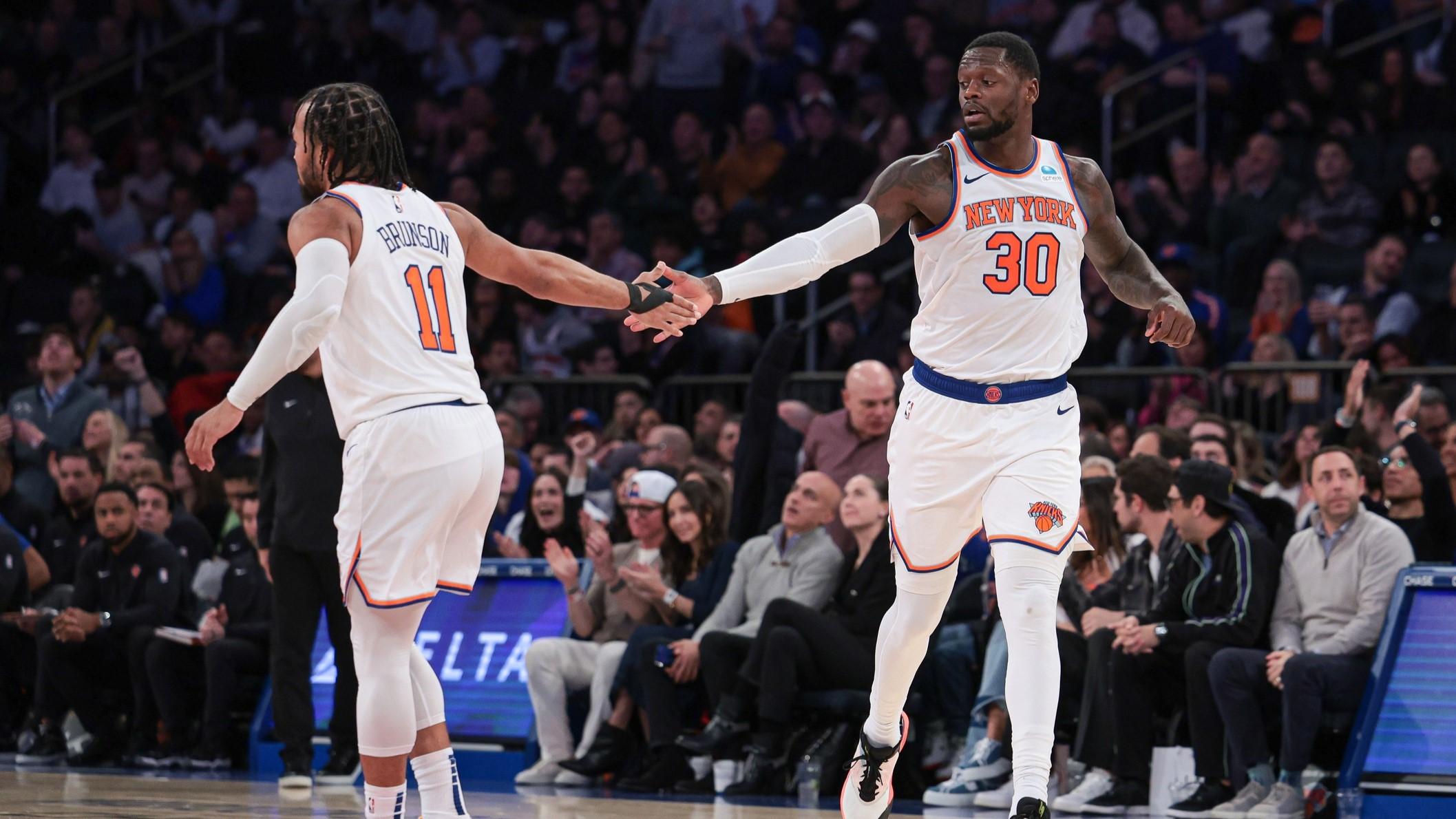 Nov 30, 2023; New York, New York, USA; New York Knicks forward Julius Randle (30) slaps hands with guard Jalen Brunson (11) after a basket during the second half against the Detroit Pistons at Madison Square Garden. / Vincent Carchietta-USA TODAY Sports