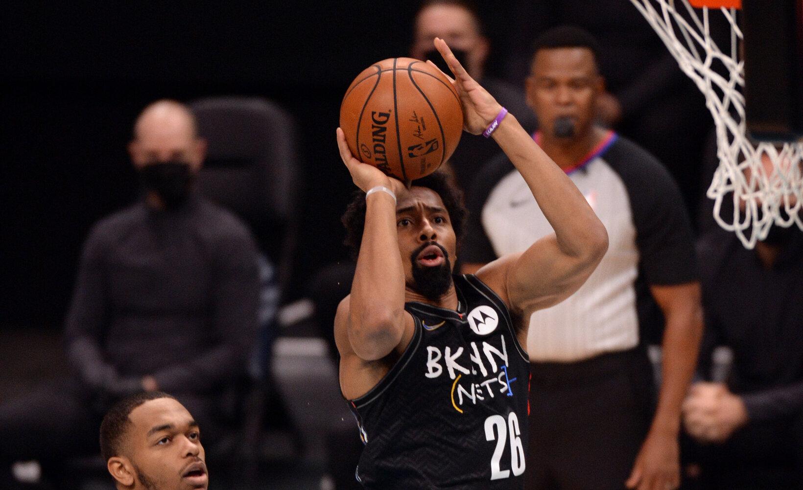 Dec 27, 2020; Charlotte, North Carolina, USA; Brooklyn Nets guard Spencer Dinwiddie (26) shoots during the first half against the Charlotte Hornets at the Spectrum Center. / USA Today