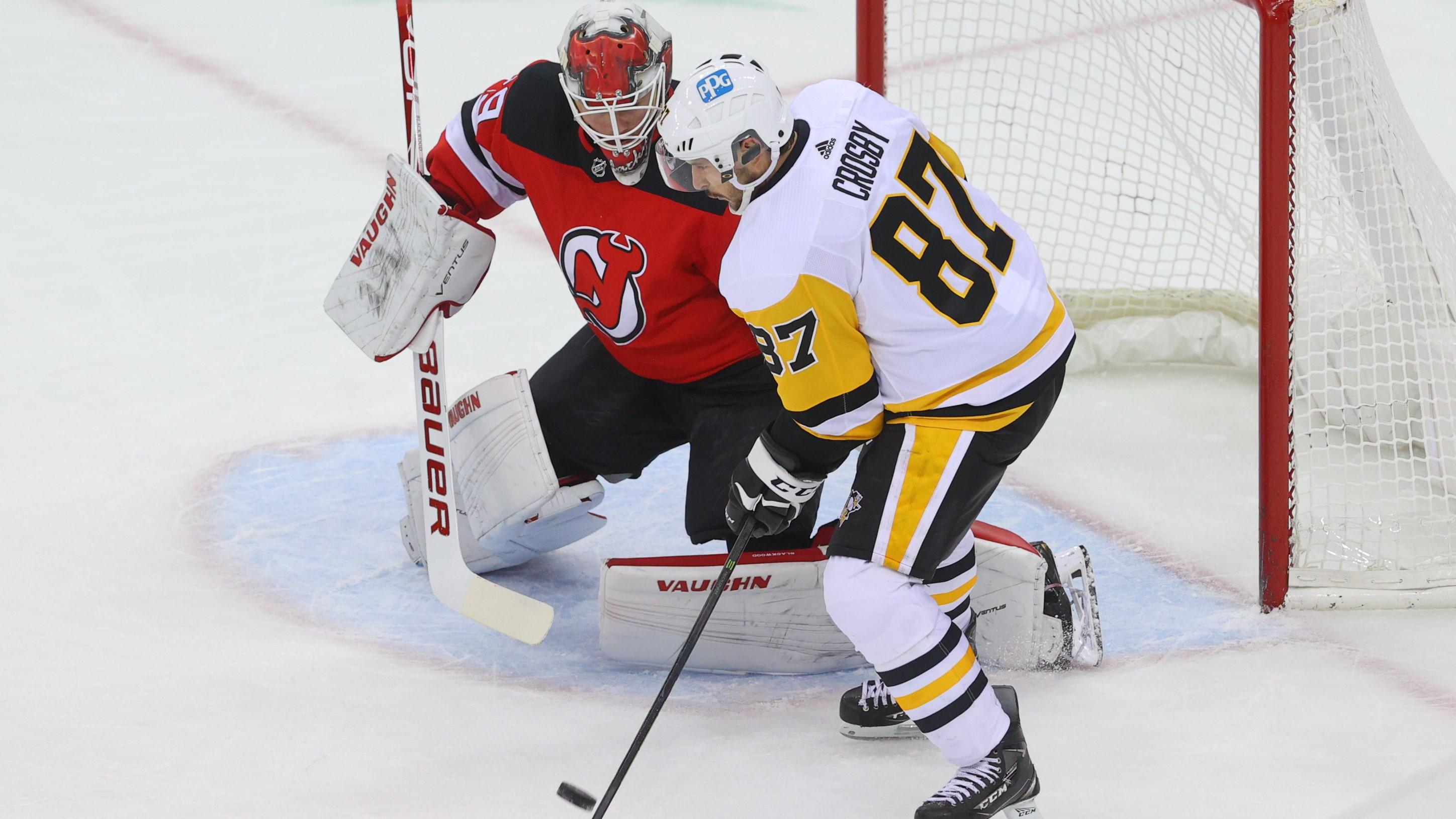 Apr 9, 2021; Newark, New Jersey, USA; New Jersey Devils goaltender Mackenzie Blackwood (29) makes a save on Pittsburgh Penguins center Sidney Crosby (87) during the first period at Prudential Center. / Ed Mulholland-USA TODAY Sports