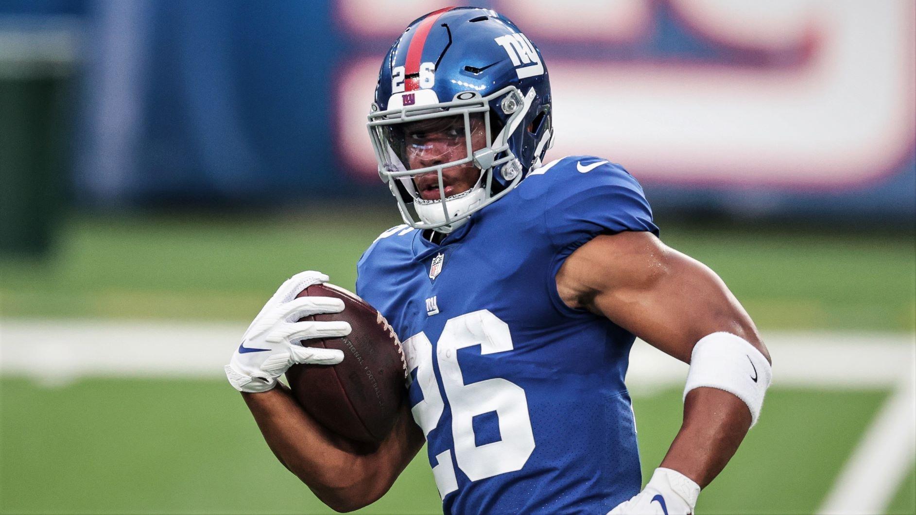 Aug 28, 2020; East Rutherford, New Jersey, USA; New York Giants running back Saquon Barkley (26) runs with the ball before the Blue-White Scrimmage at MetLife Stadium. / Vincent Carchietta-USA TODAY Sports