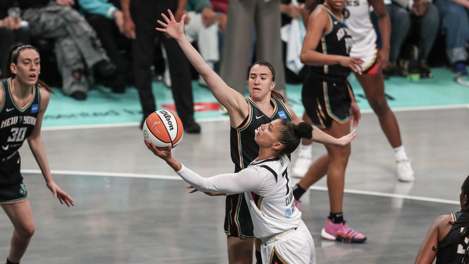 Oct 18, 2023; Brooklyn, New York, USA; Las Vegas Aces forward Alysha Clark (7) drives past New York Liberty guard Sabrina Ionescu (20) in the first quarter during game four of the 2023 WNBA Finals at Barclays Center. / Wendell Cruz-USA TODAY Sports