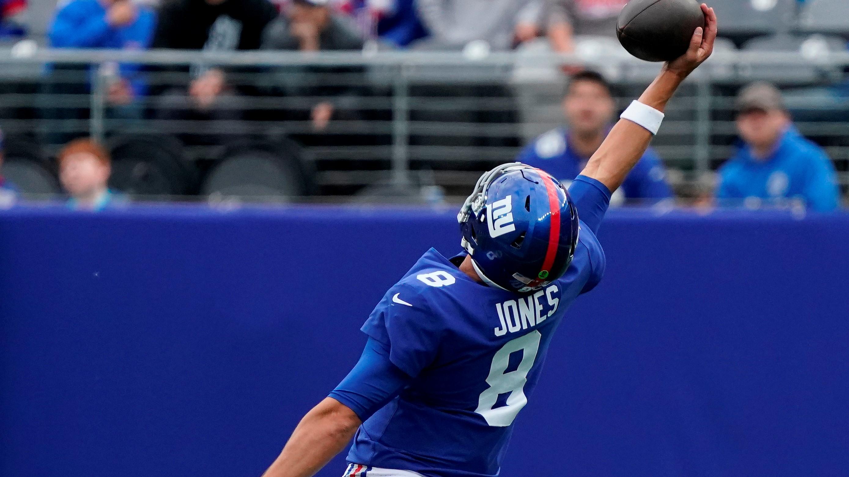 Oct 24, 2021; East Rutherford, NJ, USA; New York Giants quarterback Daniel Jones (8) catches a pass on a trick play against the Carolina Panthers at MetLife Stadium. Mandatory Credit: Robert Deutsch-USA TODAY Sports / Robert Deutsch-USA TODAY Sports