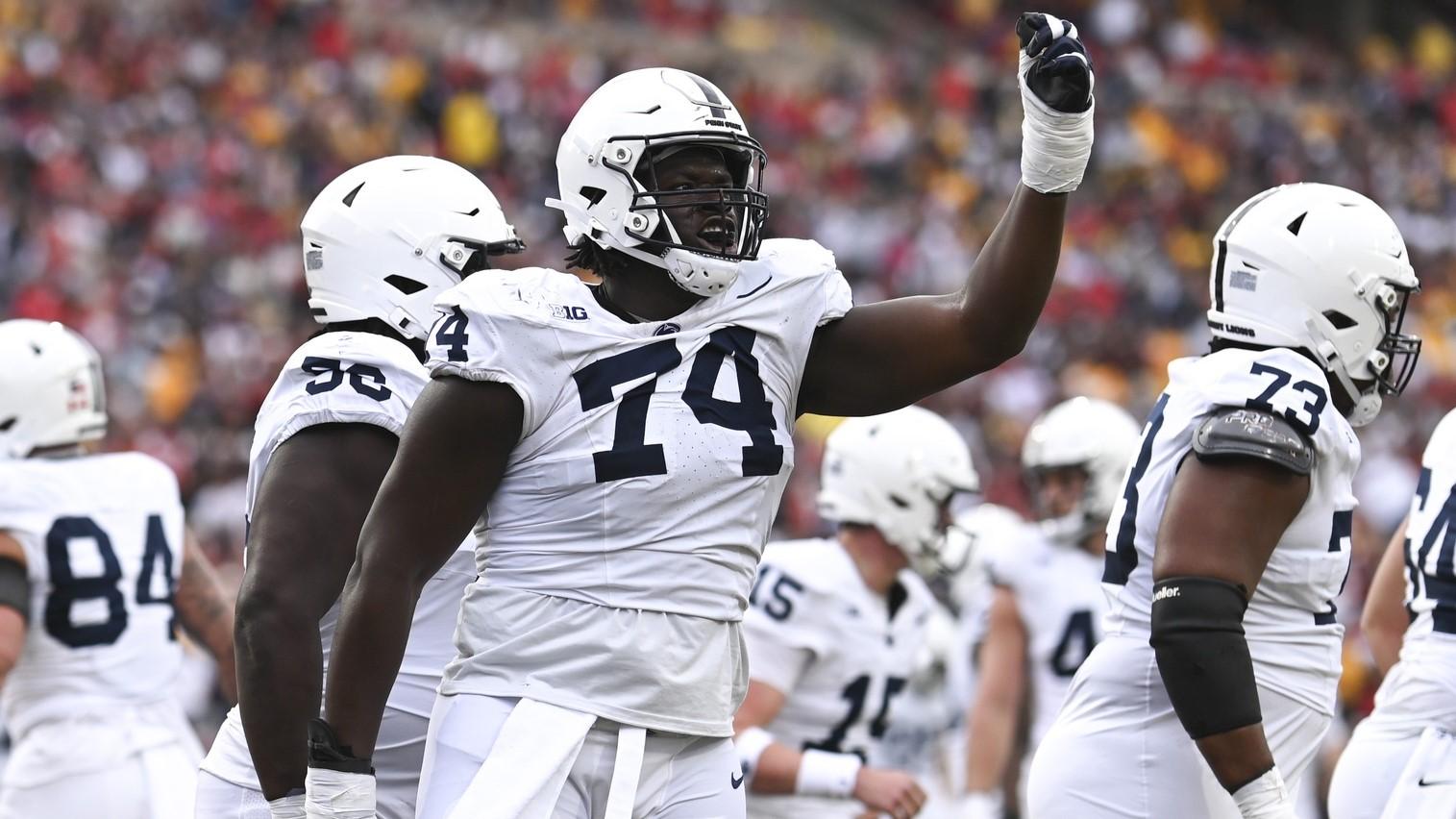 Nov 4, 2023; College Park, Maryland, USA; Penn State Nittany Lions offensive lineman Olumuyiwa Fashanu (74) celebrates after a first half touchdown against the Maryland Terrapins at SECU Stadium. / Tommy Gilligan-USA TODAY Sports