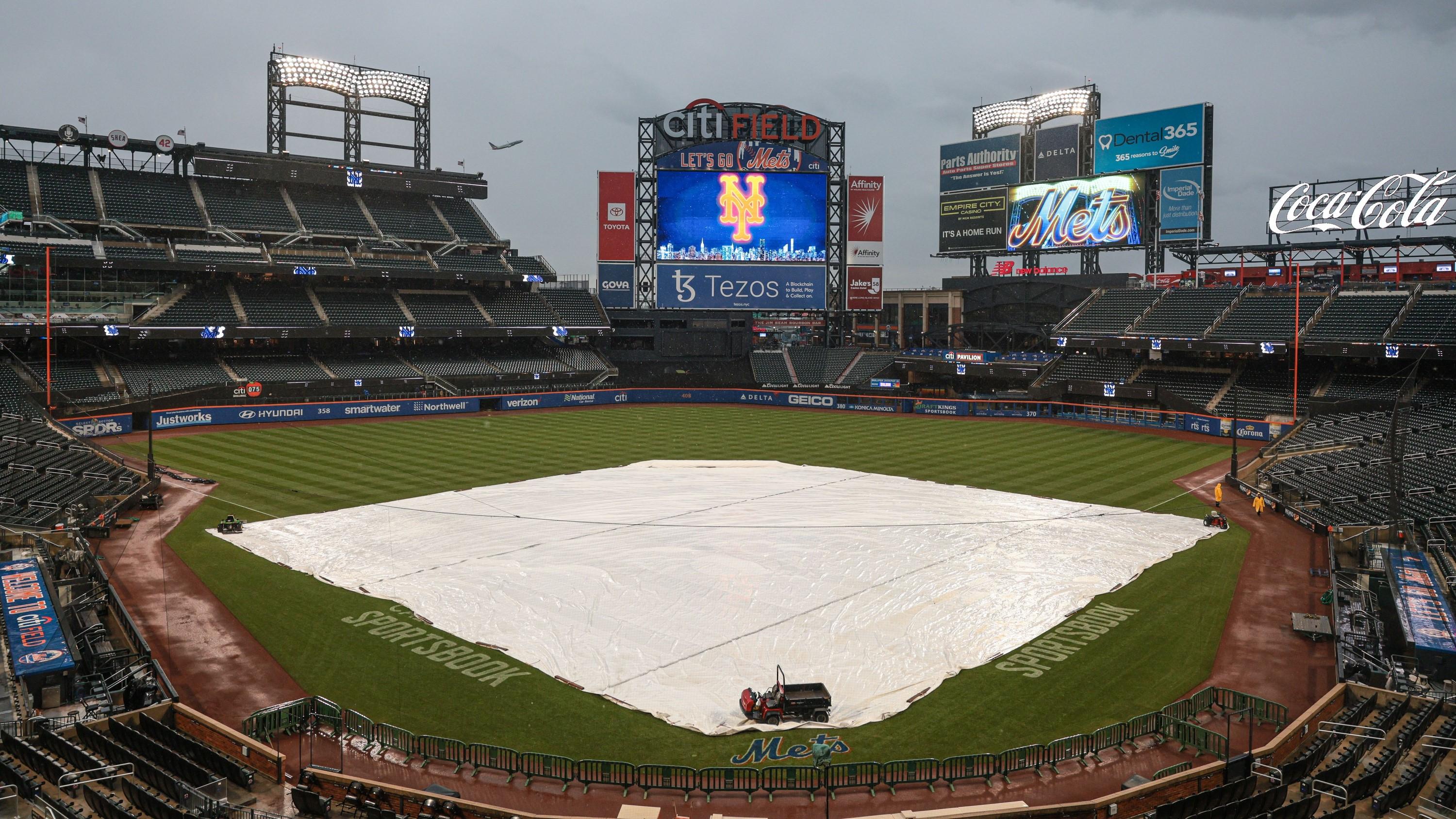 Oct 3, 2022; New York City, New York, USA; A general view of the tarp on the field before the game between the New York Mets and the Washington Nationals at Citi Field. / Vincent Carchietta-USA TODAY Sports
