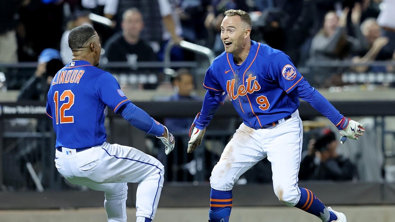Jun 14, 2023; New York City, New York, USA; New York Mets center fielder Brandon Nimmo (9) celebrates with shortstop Francisco Lindor (12) after hitting a tenth inning walkoff double against the New York Yankees at Citi Field. / Brad Penner-USA TODAY Sports
