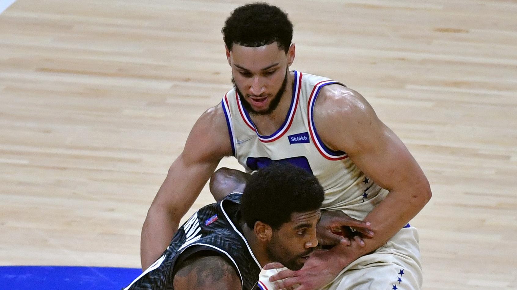 Apr 14, 2021; Philadelphia, Pennsylvania, USA; Brooklyn Nets guard Kyrie Irving (11) is guarded by Philadelphia 76ers guard Ben Simmons (25) during the second quarter at Wells Fargo Center. Mandatory Credit: Eric Hartline-USA TODAY Sports / © Eric Hartline-USA TODAY Sports
