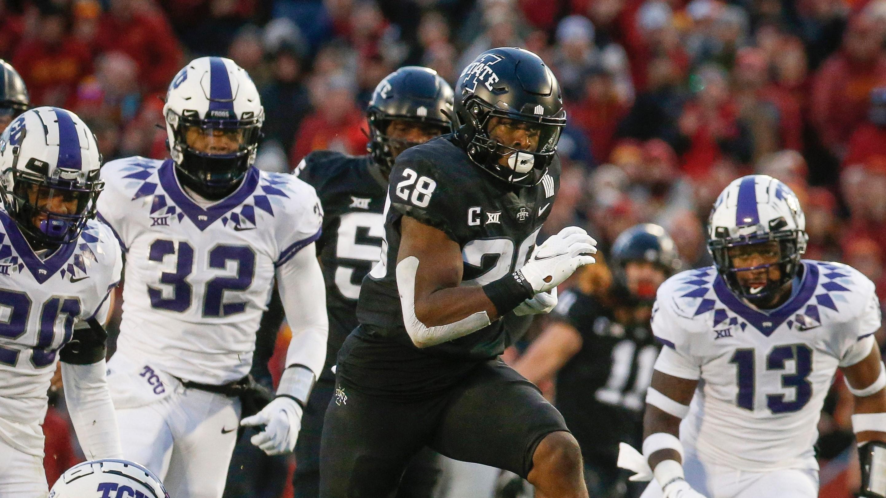 Iowa State junior running back Breece Hall breaks the tackle of TCU safety Nook Bradford en route to the end zone for a touchdown in the second quarter / Bryon Houlgrave/The Register-USA TODAY NETWORK