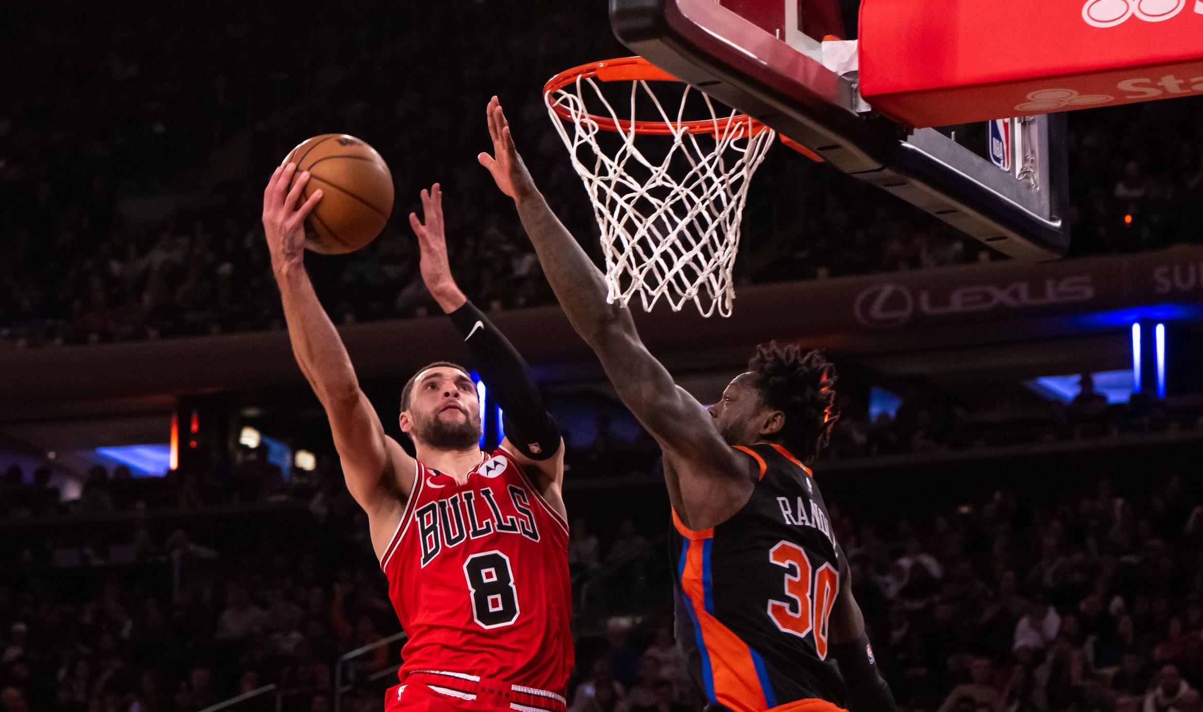 Chicago Bulls guard Zach LaVine (8) drives to the basket as New York Knicks forward Julius Randle (30) defends during the fourth quarter at Madison Square Garden. / John Jones-USA TODAY Sports