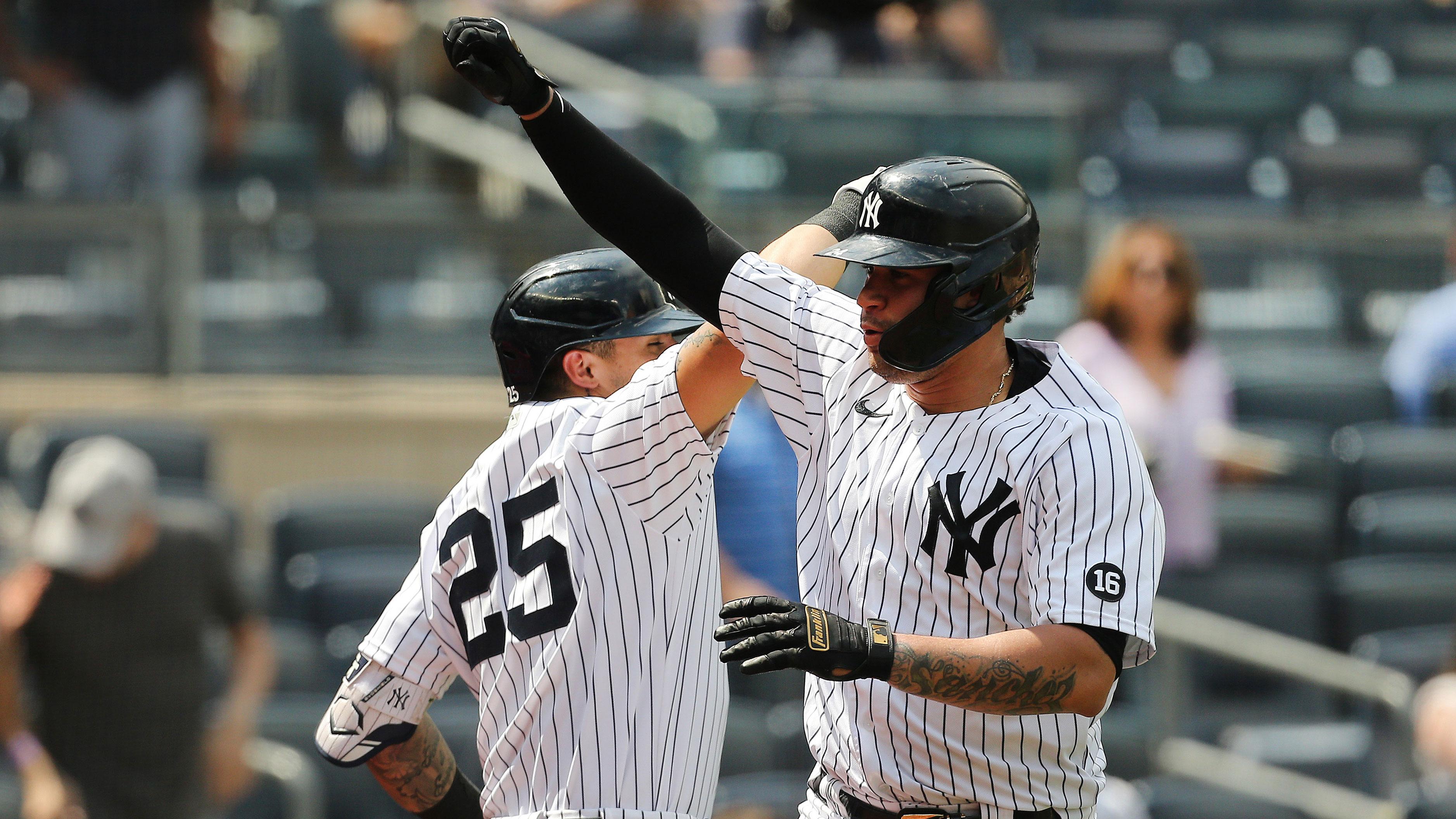 Jun 19, 2021; Bronx, New York, USA; New York Yankees catcher Gary Sanchez (24) reacts with shortstop Gleyber Torres (25) after hitting a solo home run against the Oakland Athletics during the sixth inning at Yankee Stadium. / Andy Marlin-USA TODAY Sports