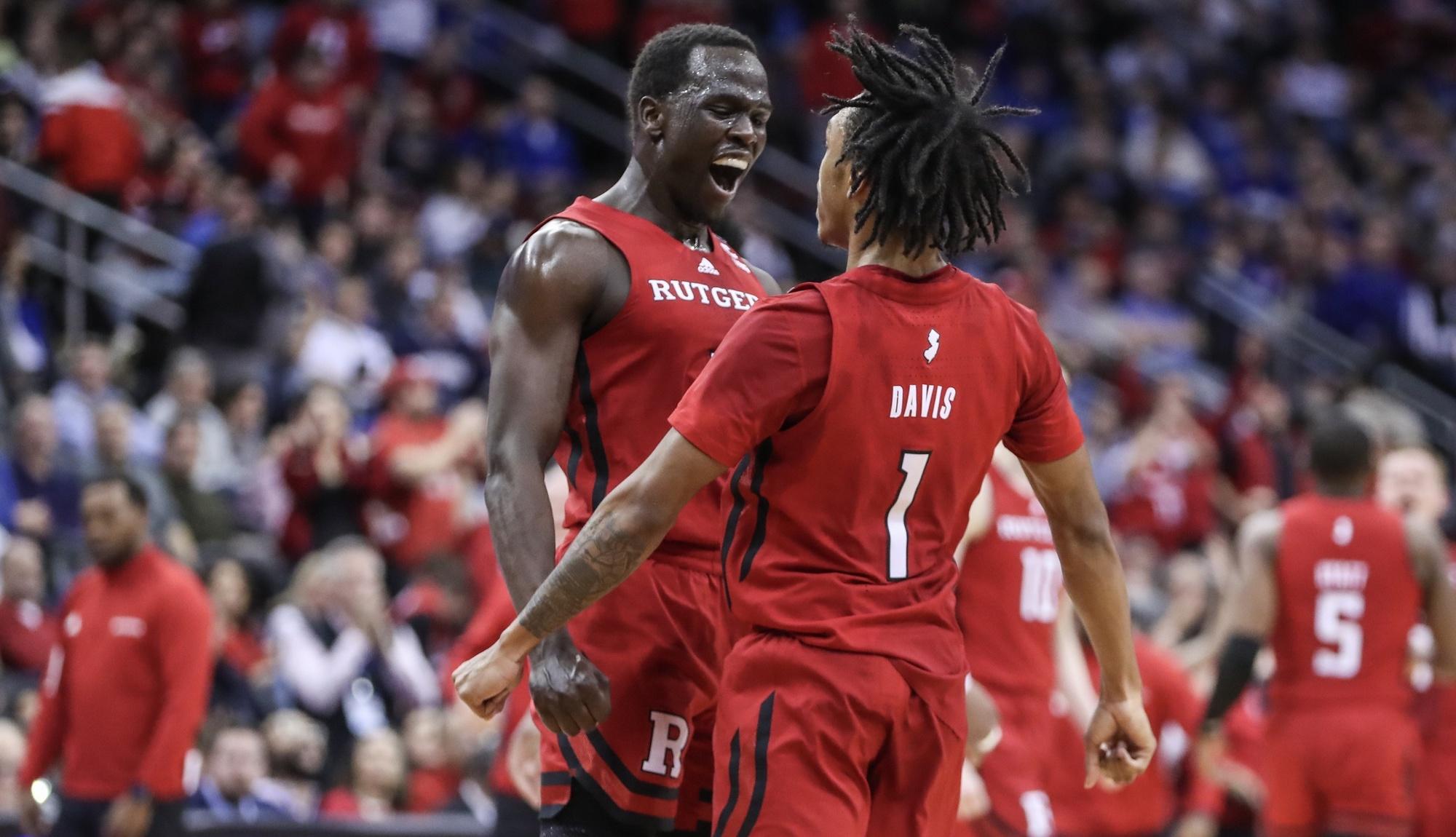 Rutgers Scarlet Knights forward Mawot Mag (3) celebrates with guard Jamichael Davis (1) after the Seton Hall Pirates call a timeout in the first half at Prudential Center. / Wendell Cruz-USA TODAY Sports