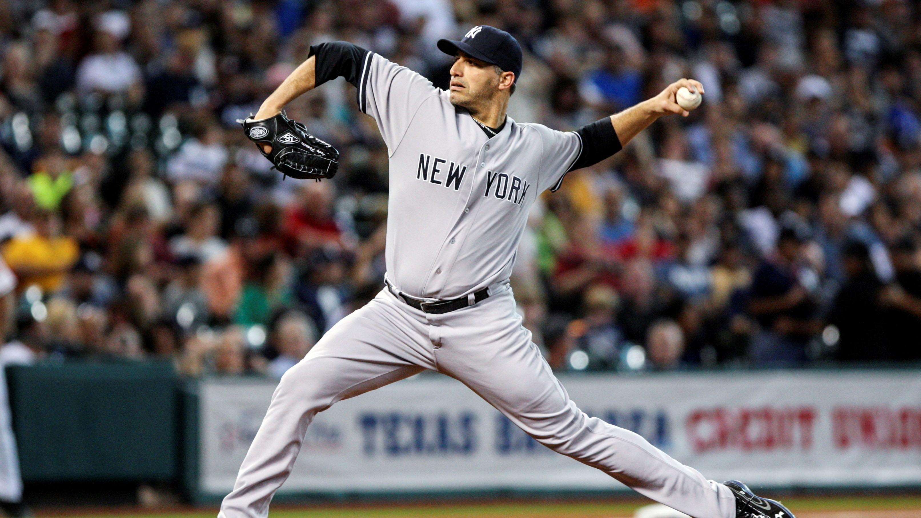 New York Yankees starting pitcher Andy Pettitte (46) pitches during the first inning against the Houston Astros at Minute Maid Park. / Troy Taormina-USA TODAY Sports
