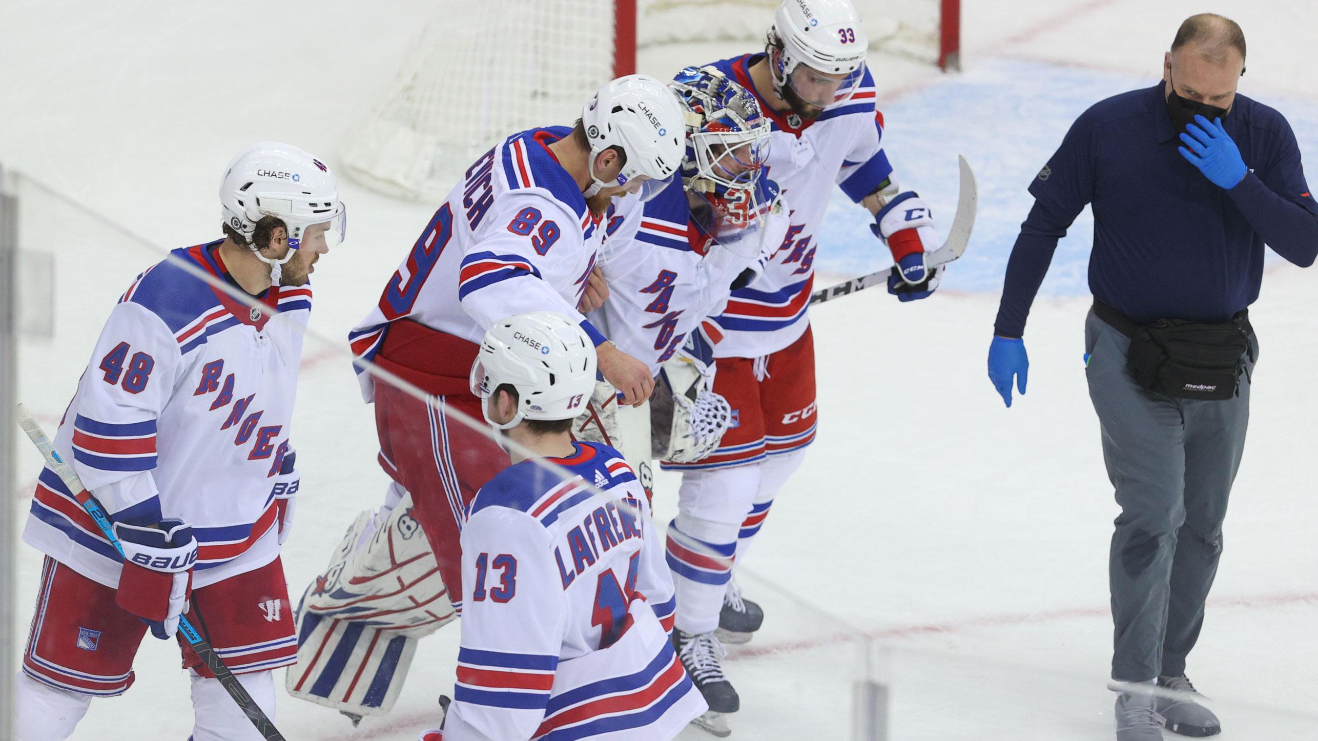 Mar 4, 2021; Newark, New Jersey, USA; New York Rangers goaltender Igor Shesterkin (31) is helped off the ice during the third period of their game against the New Jersey Devils at Prudential Center. / Ed Mulholland-USA TODAY Sports