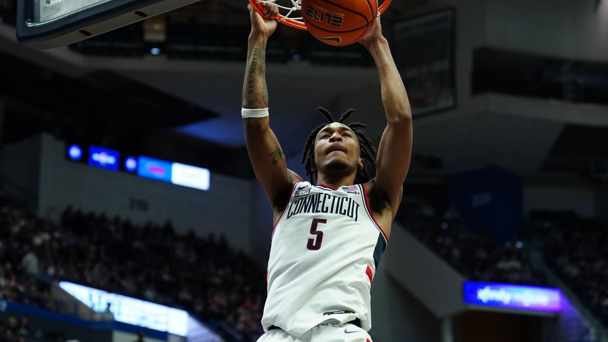Jan 14, 2024; Hartford, Connecticut, USA; Connecticut Huskies guard Stephon Castle (5) makes the basket against the Georgetown Hoyas in the second half at XL Center. / David Butler II-USA TODAY Sports