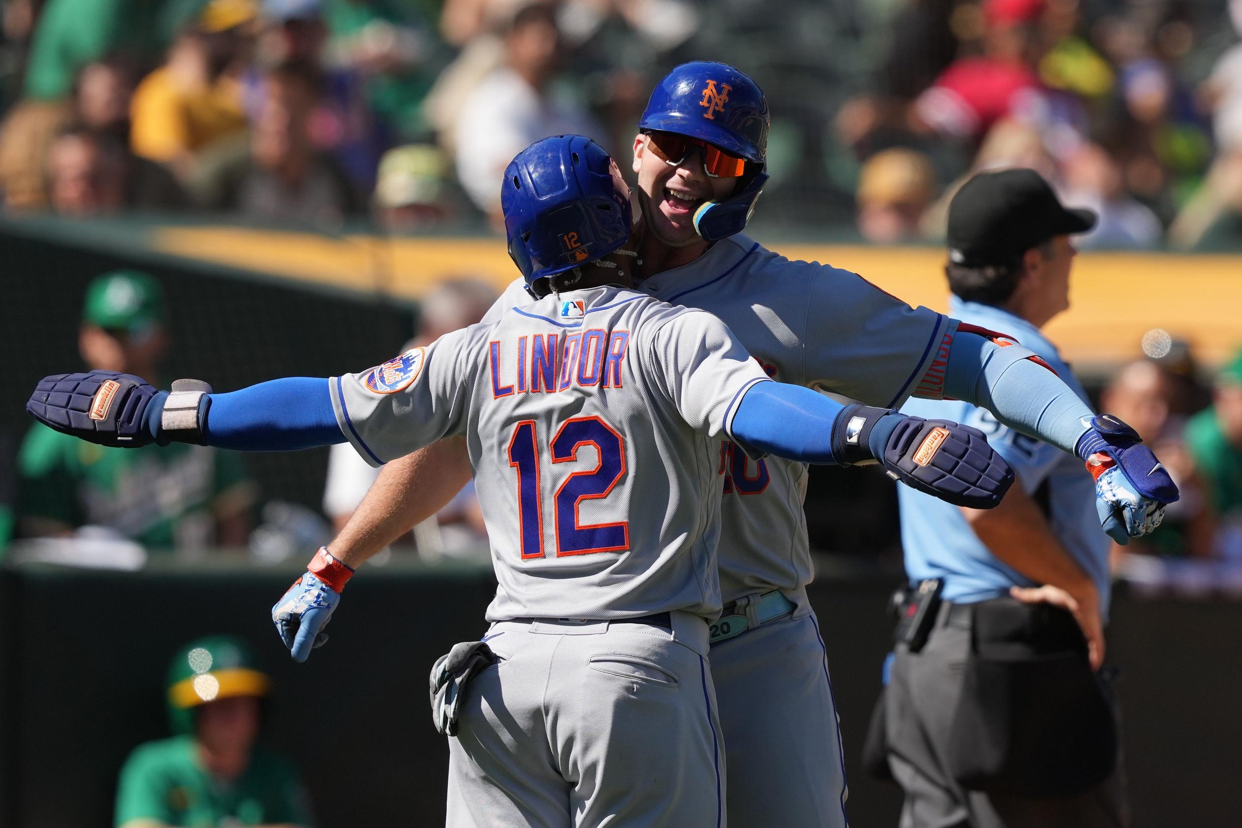 New York Mets designated hitter Pete Alonso (right) celebrates with shortstop Francisco Lindor (12) after hitting a home run against the Oakland Athletics during the fourth inning at RingCentral Coliseum. / Darren Yamashita-USA TODAY Sports