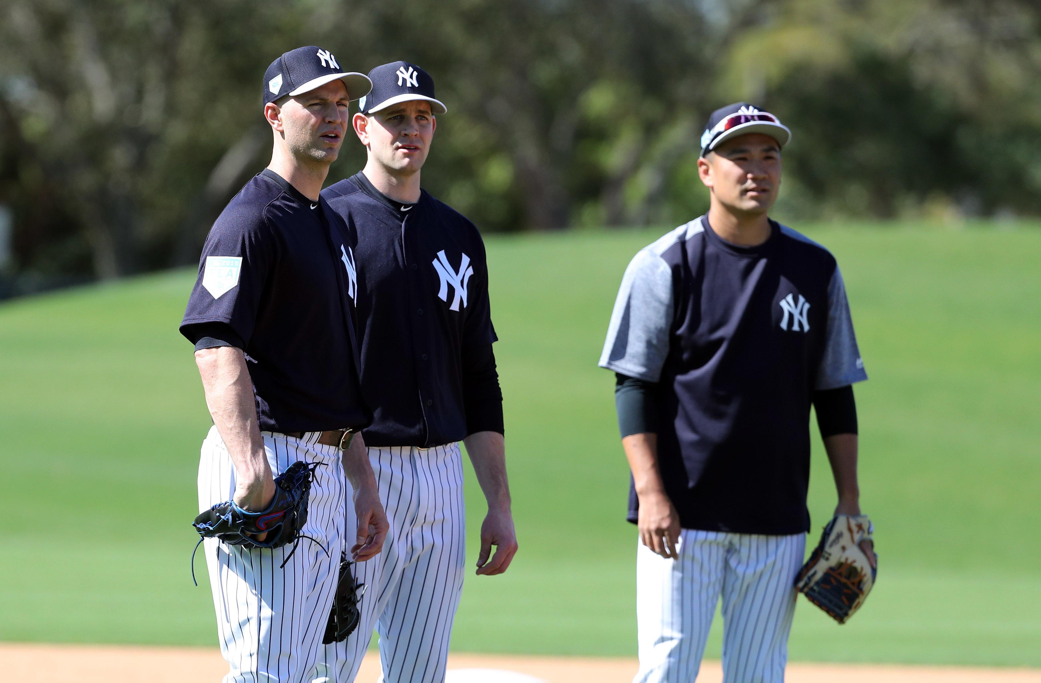 Feb 14, 2019; Tampa, FL, USA;New York Yankees starting pitcher J.A. Happ (34), starting pitcher James Paxton (65), starting pitcher Masahiro Tanaka (19) look on as they practice during spring training at George M. Steinbrenner Field. Mandatory Credit: Kim Klement-USA TODAY Sports / © Kim Klement-USA TODAY Sports