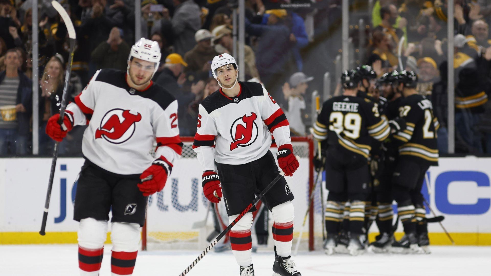 Dec 30, 2023; Boston, Massachusetts, USA; New Jersey Devils defenseman John Marino (6) and right wing Timo Meier (28) skate back to the bench as the Boston Bruins celebrate one of their four goals during the second period at TD Garden. / Winslow Townson-USA TODAY Sports