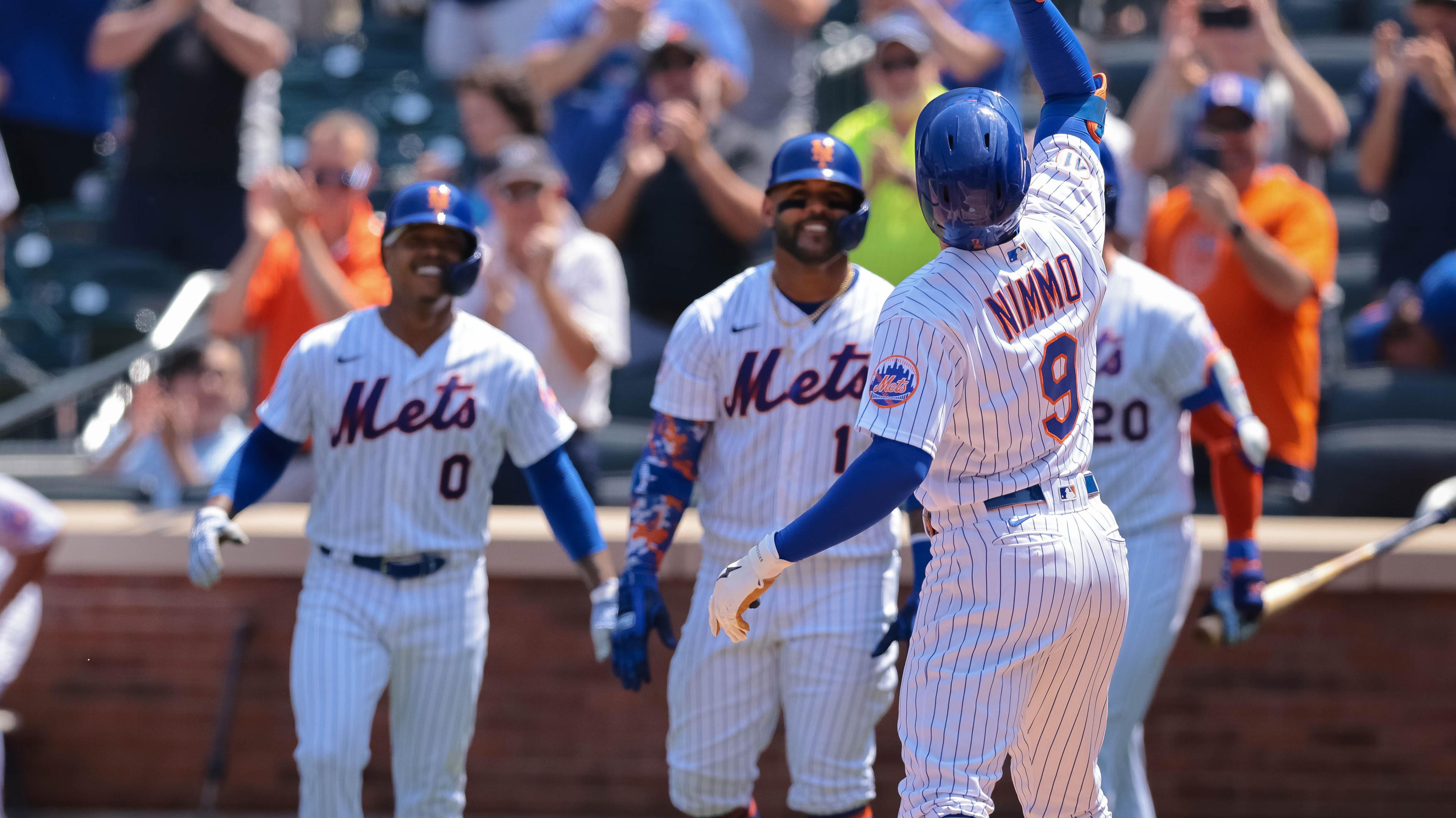 Aug 12, 2021; New York City, NY, USA; New York Mets center fielder Brandon Nimmo (9) celebrates with teammates after hitting a three run home run during the second inning against the Washington Nationals at Citi Field. / Vincent Carchietta-USA TODAY Sports