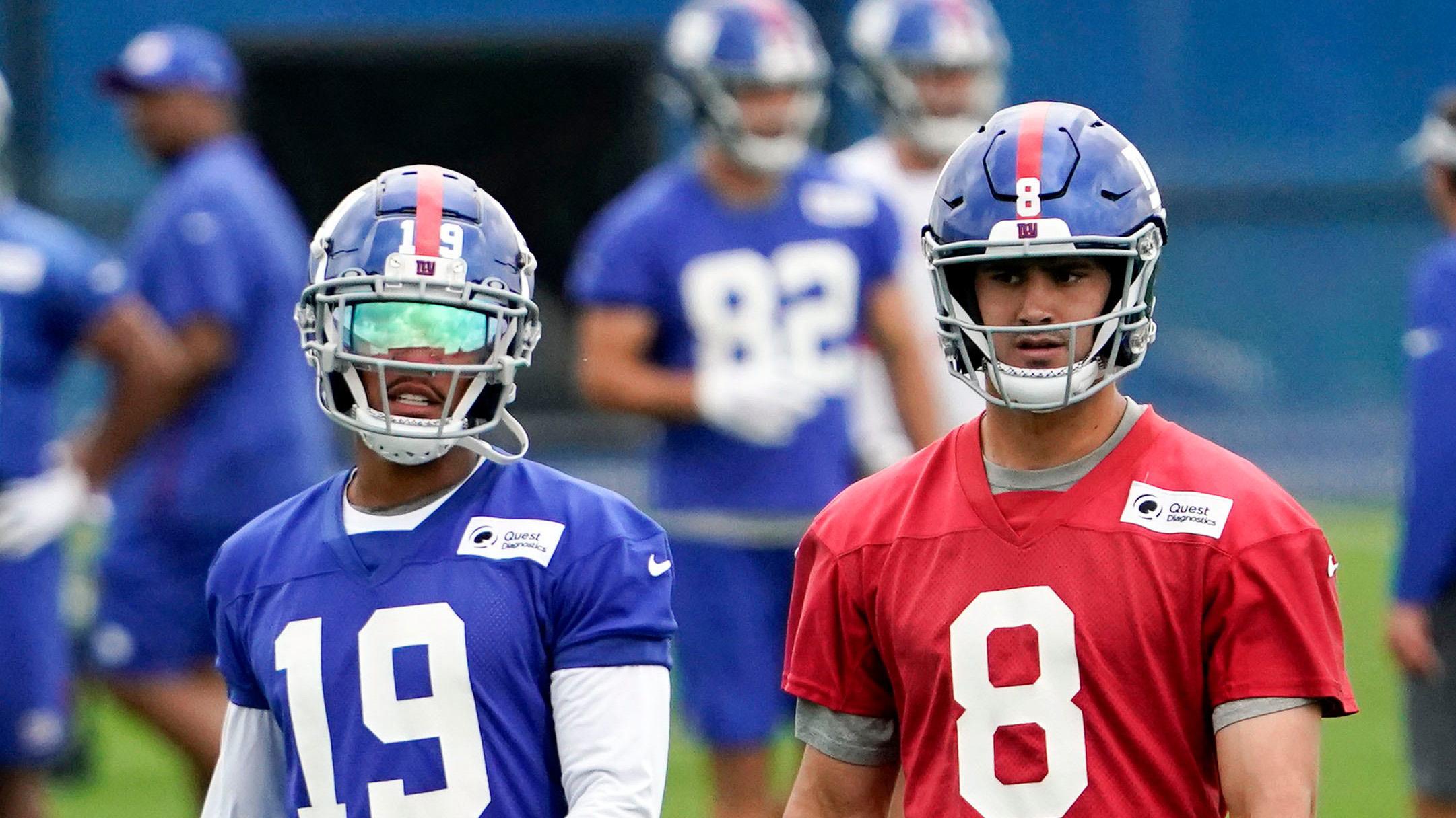 New York Giants wide receiver Kenny Golladay (19) and quarterback Daniel Jones (8) walk on the field together during OTA practice at the Quest Diagnostics Training Center / Danielle Parhizkaran/USA TODAY