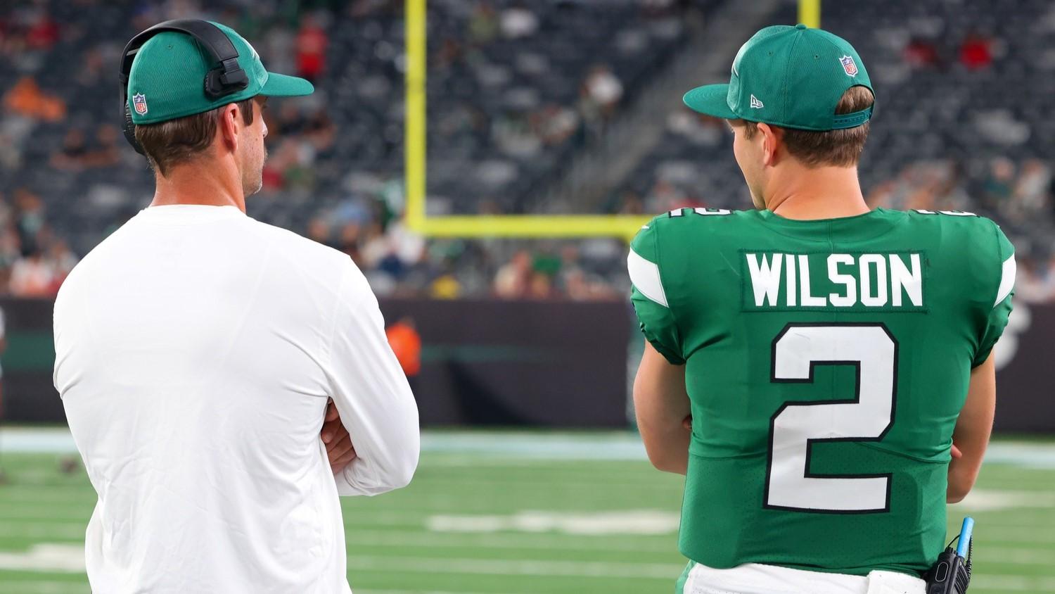Aug 19, 2023; East Rutherford, New Jersey, USA; New York Jets quarterback Aaron Rodgers (8) and New York Jets quarterback Zach Wilson (2) talk during the second half of their game against the Tampa Bay Buccaneers at MetLife Stadium / Ed Mulholland-USA TODAY Sports