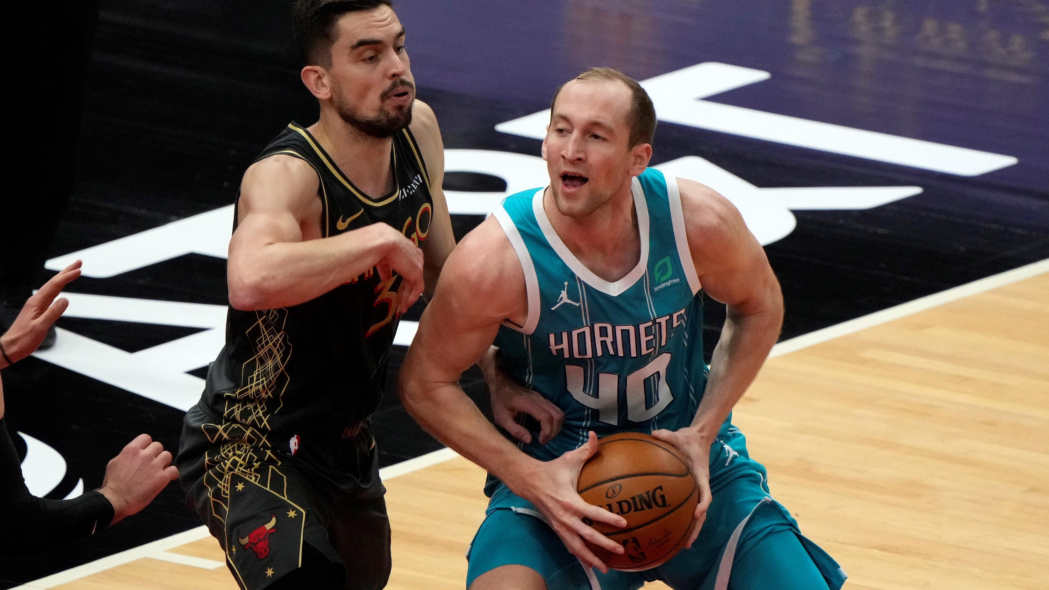 Apr 22, 2021; Chicago, Illinois, USA; Charlotte Hornets center Cody Zeller (40) attempts to shoot against Chicago Bulls guard Tomas Satoransky (31) during the second quarter at the United Center. Mandatory Credit: Mike Dinovo-USA TODAY Sports / Mike Dinovo-USA TODAY Sports
