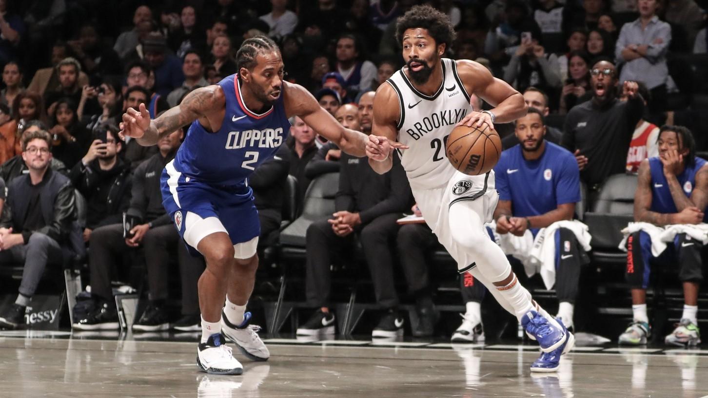 Nov 8, 2023; Brooklyn, New York, USA; Brooklyn Nets guard Spencer Dinwiddie (26) drives past LA Clippers forward Kawhi Leonard (2) in the first quarter at Barclays Center. / Wendell Cruz-USA TODAY Sports