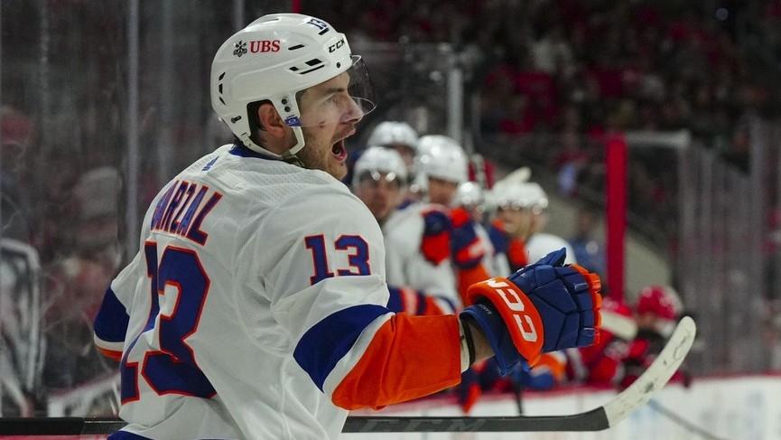 New York Islanders center Mathew Barzal (13) celebrates his goal against the Carolina Hurricanes during the second period in game five of the first round of the 2023 Stanley Cup Playoffs. / James Guillory-USA TODAY Sports