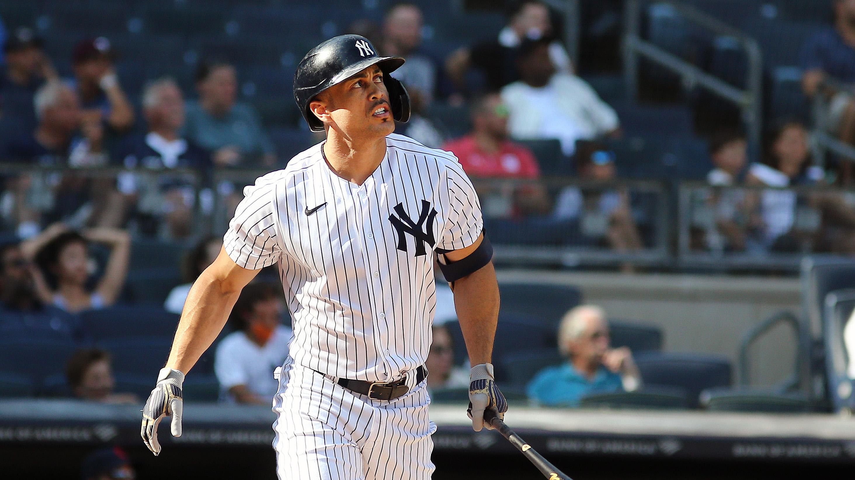 New York Yankees designated hitter Giancarlo Stanton (27) hits a two run home run against the Cleveland Indians during the seventh inning at Yankee Stadium. / Andy Marlin-USA TODAY Sports