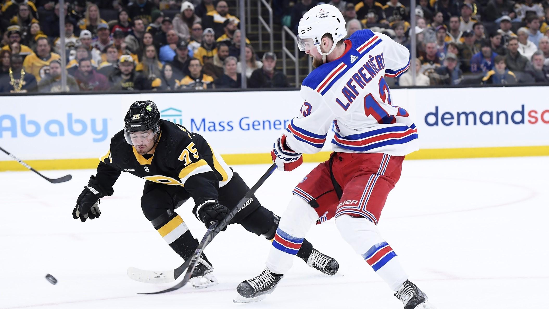 Mar 4, 2023; Boston, Massachusetts, USA; New York Rangers left wing Alexis Lafreniere (13) shoots the puck while Boston Bruins defenseman Connor Clifton (75) defends during the second period at TD Garden. / Bob DeChiara-USA TODAY Sports