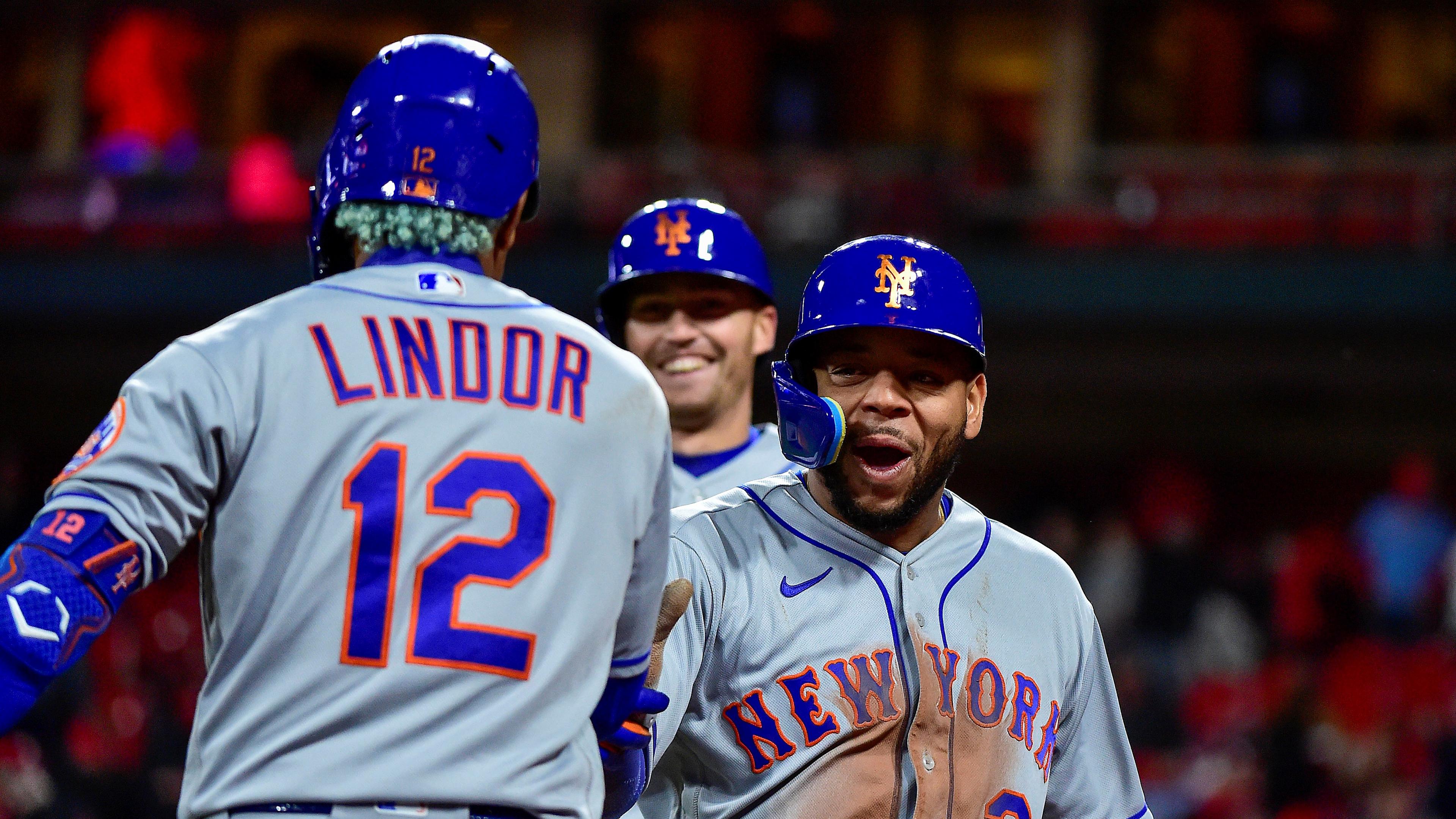 Apr 25, 2022; St. Louis, Missouri, USA; New York Mets pinch hitter Dominic Smith (2) celebrates with shortstop Francisco Lindor (12) after driving in two runs on a single and scoring against the St. Louis Cardinals during the ninth inning at Busch Stadium. Mandatory Credit: Jeff Curry-USA TODAY Sports / Jeff Curry-USA TODAY Sports