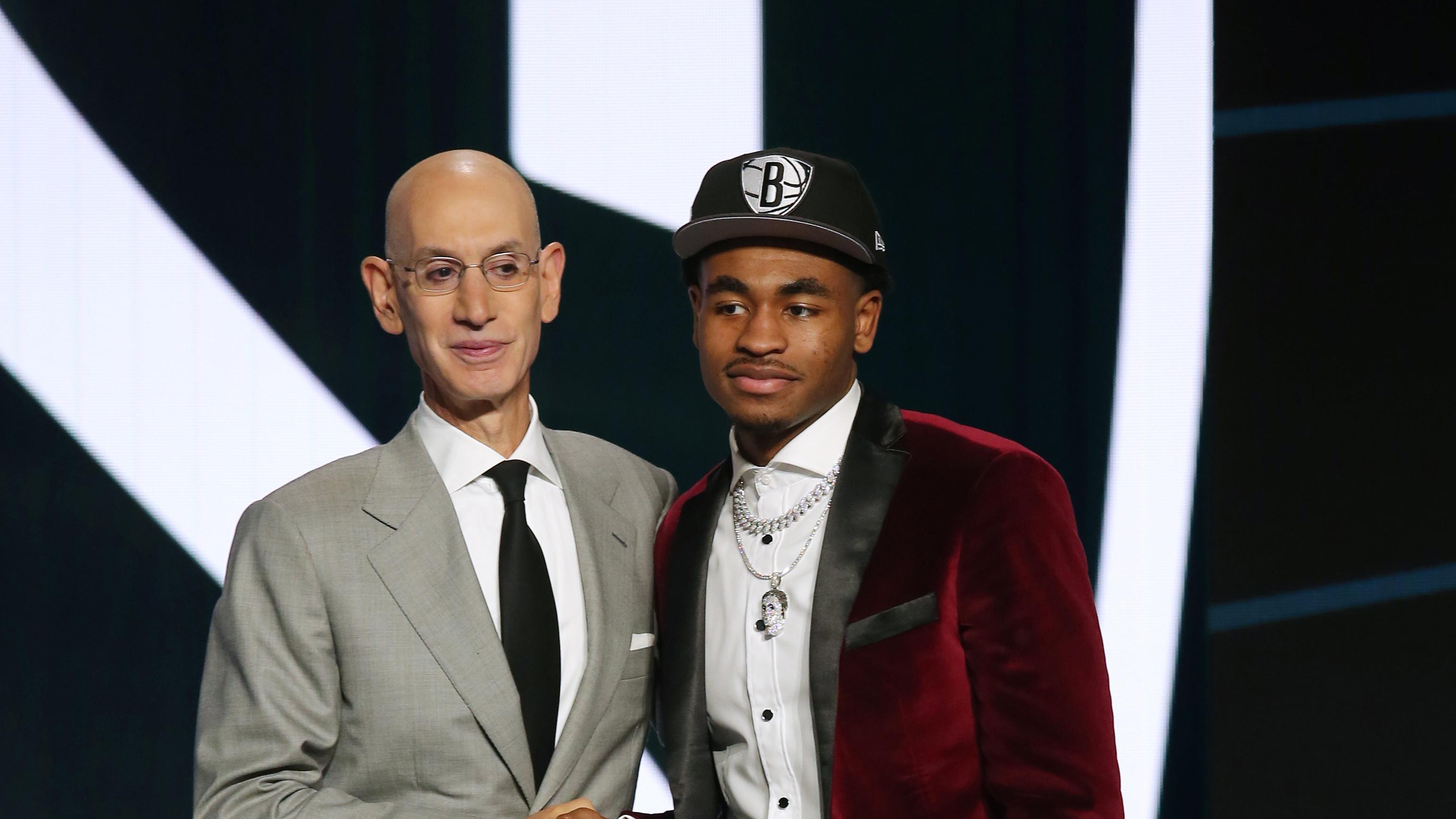 Cameron Thomas (LSU) poses with NBA commissioner Adam Silver after being selected as the number twenty-seven overall pick by the Brooklyn Nets in the first round of the 2021 NBA Draft / Brad Penner-USA TODAY Sports