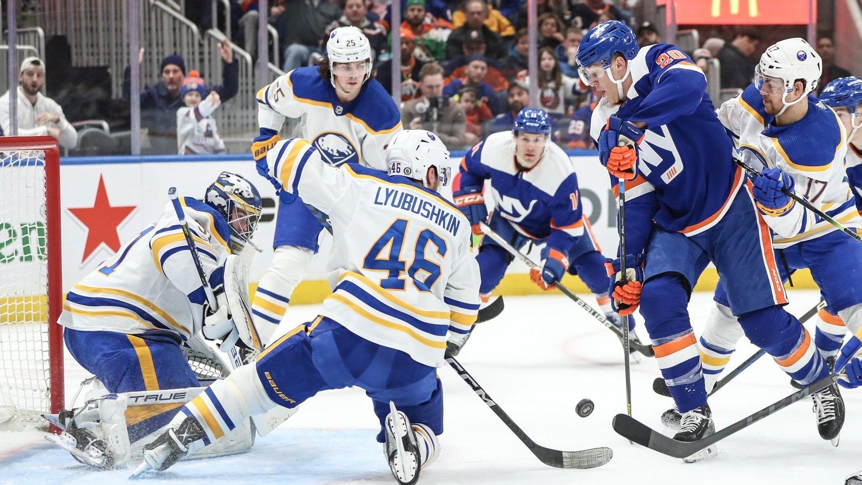 New York Islanders right wing Hudson Fasching (20) attempts a shot on goal in the second period against the Buffalo Sabres. / Wendell Cruz-USA TODAY Sports