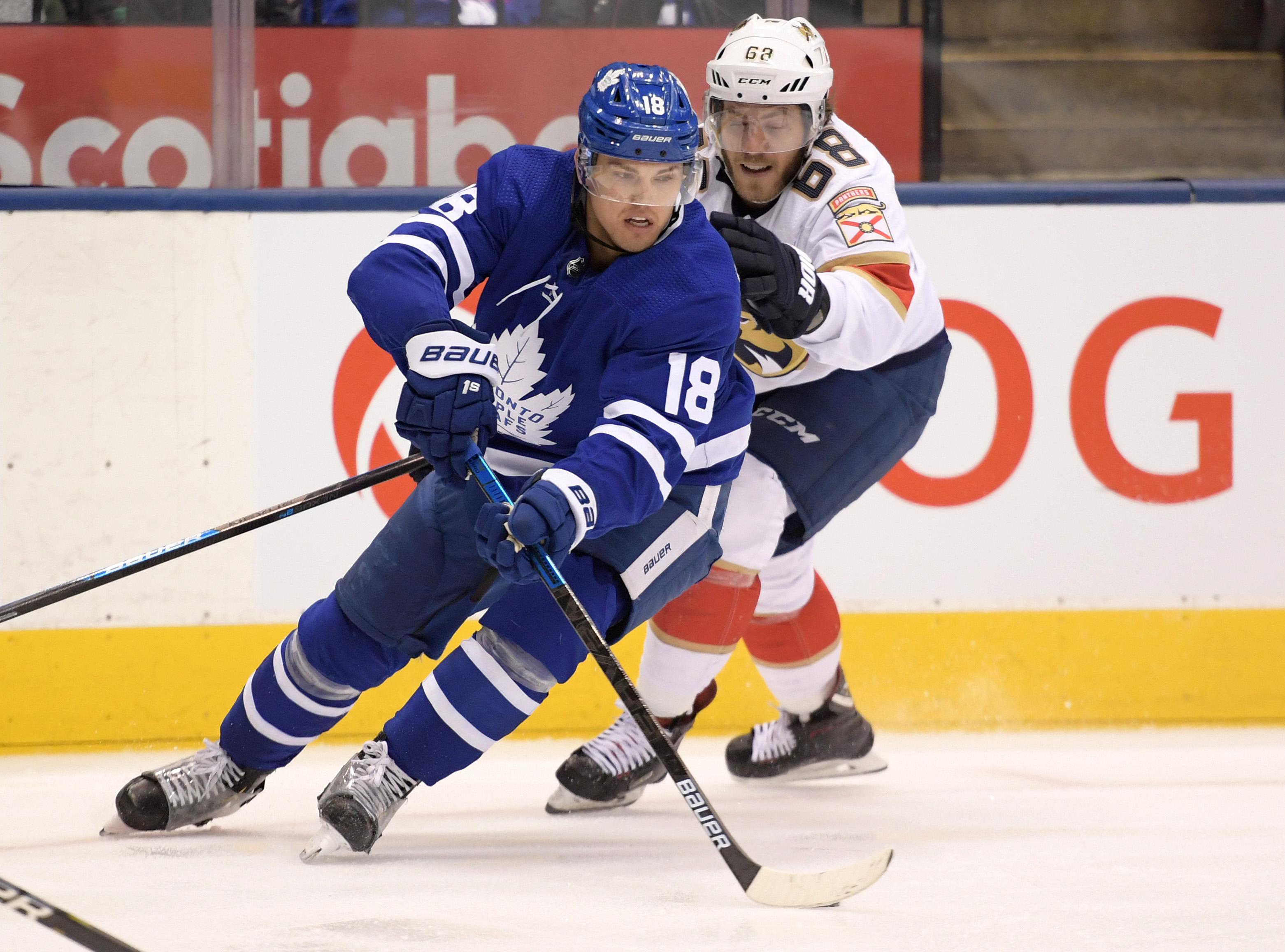 Feb 3, 2020; Toronto, Ontario, CAN; Toronto Maple Leafs forward Andreas Johnsson (18) cuts past Florida Panthers forward Mike Hoffman (68) in the second period at Scotiabank Arena. / Dan Hamilton-USA TODAY Sports