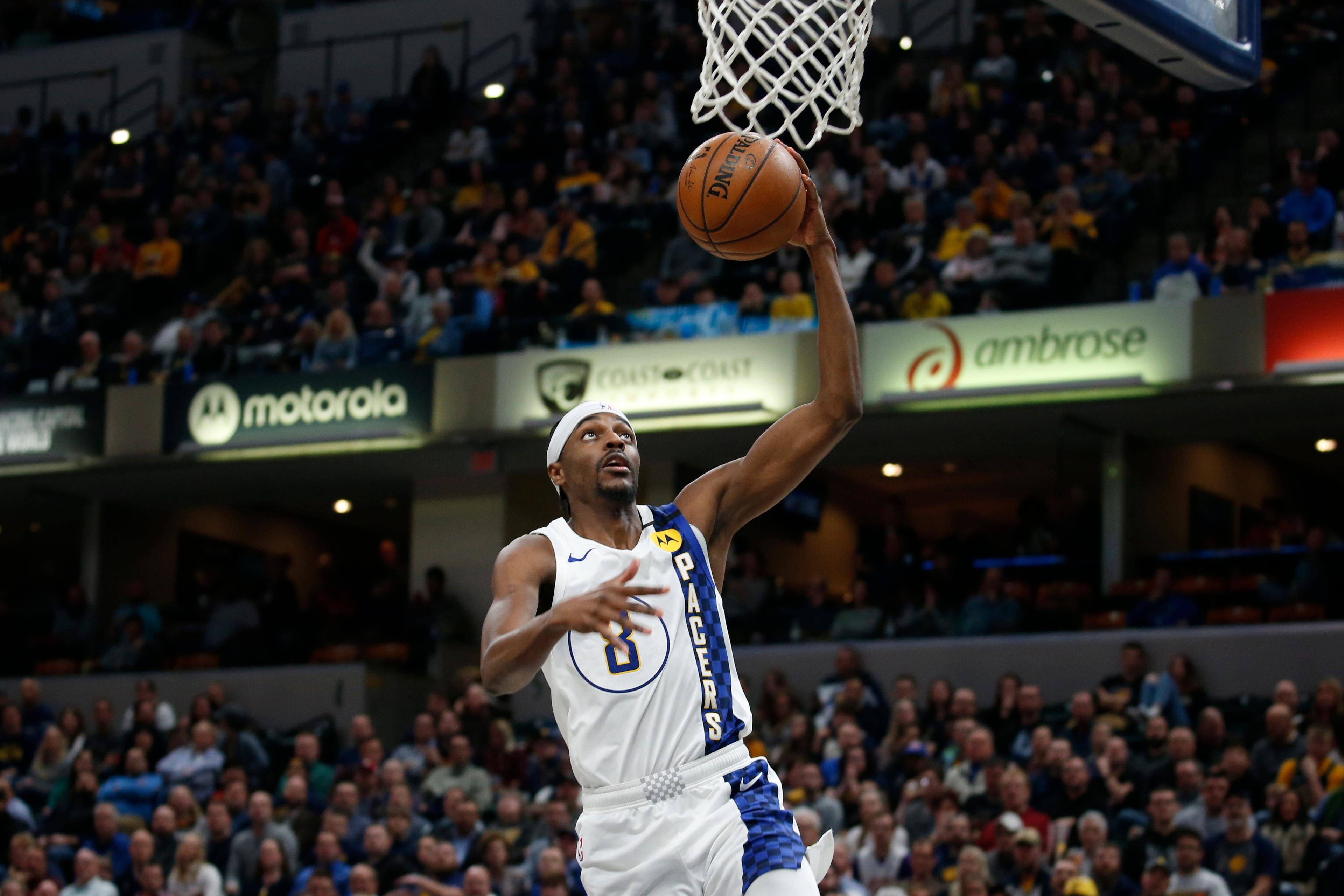 Feb 3, 2020; Indianapolis, Indiana, USA; Indiana Pacers guard Justin Holiday (8) goes up for a dunk against the Dallas Mavericks during the fourth quarter at Bankers Life Fieldhouse / Brian Spurlock-USA TODAY Sports