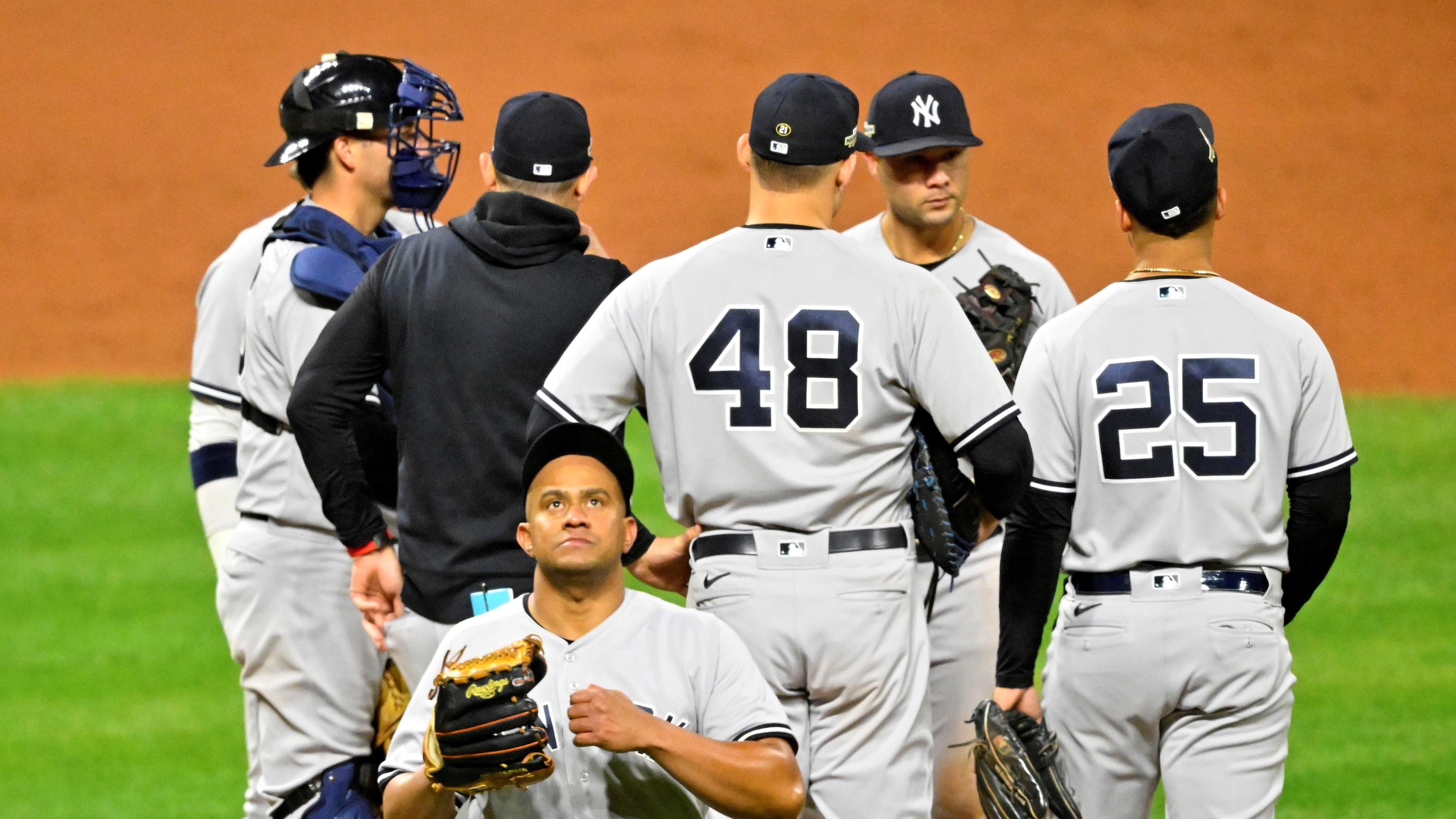 Oct 15, 2022; Cleveland, Ohio, USA; New York Yankees relief pitcher Wandy Peralta (58) walks off the mound after a pitching change against the Cleveland Guardians in the ninth inning during game three of the NLDS for the 2022 MLB Playoffs at Progressive Field. Mandatory Credit: David Richard-USA TODAY Sports / © David Richard-USA TODAY Sports