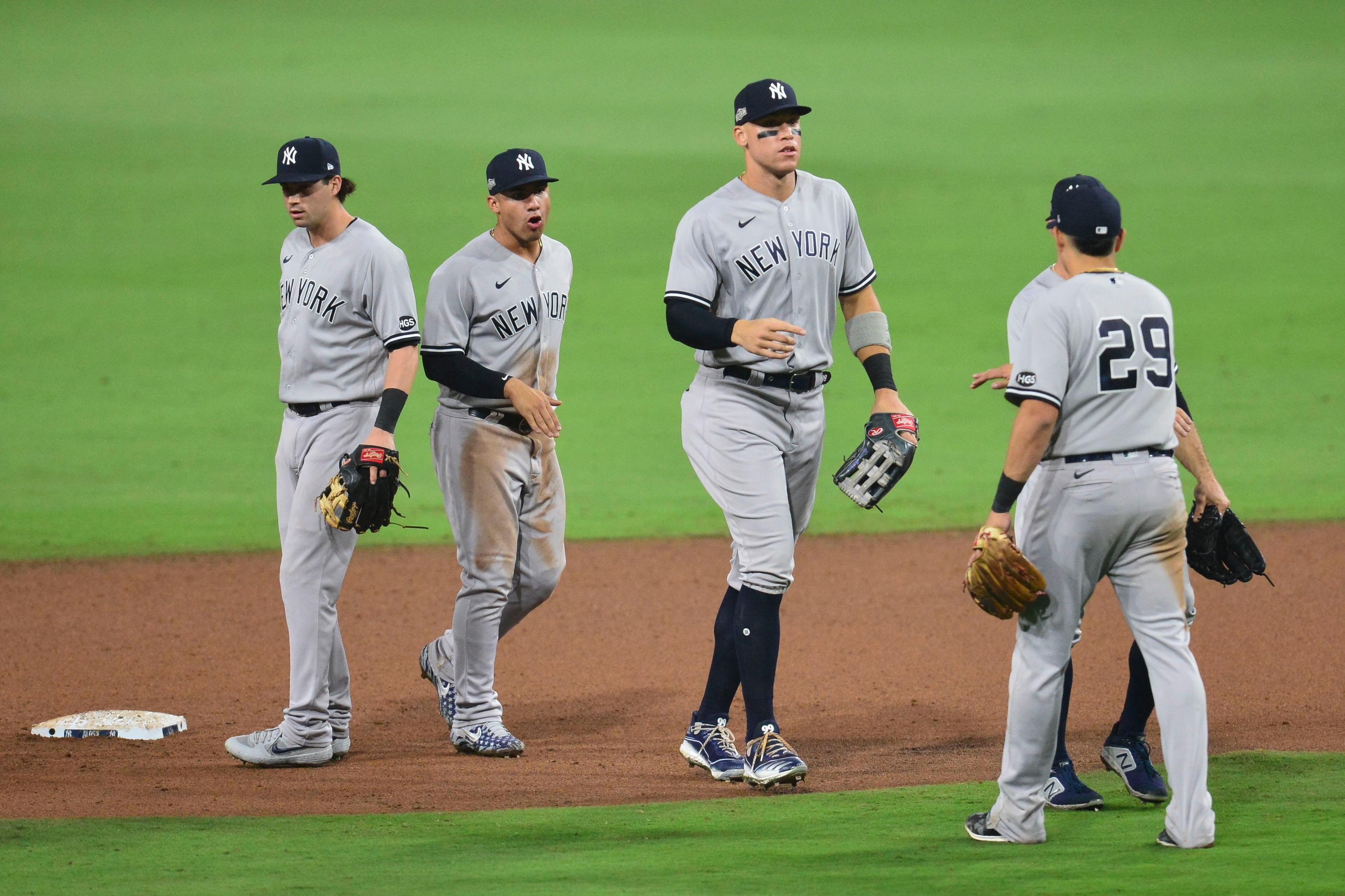Oct 5, 2020; San Diego, California, USA; New York Yankees right fielder Aaron Judge (99) celebrates with teammates after game one of the 2020 ALDS against the Tampa Bay Rays at Petco Park. Mandatory Credit: Gary A. Vasquez-USA TODAY Sports / © Gary A. Vasquez-USA TODAY Sports