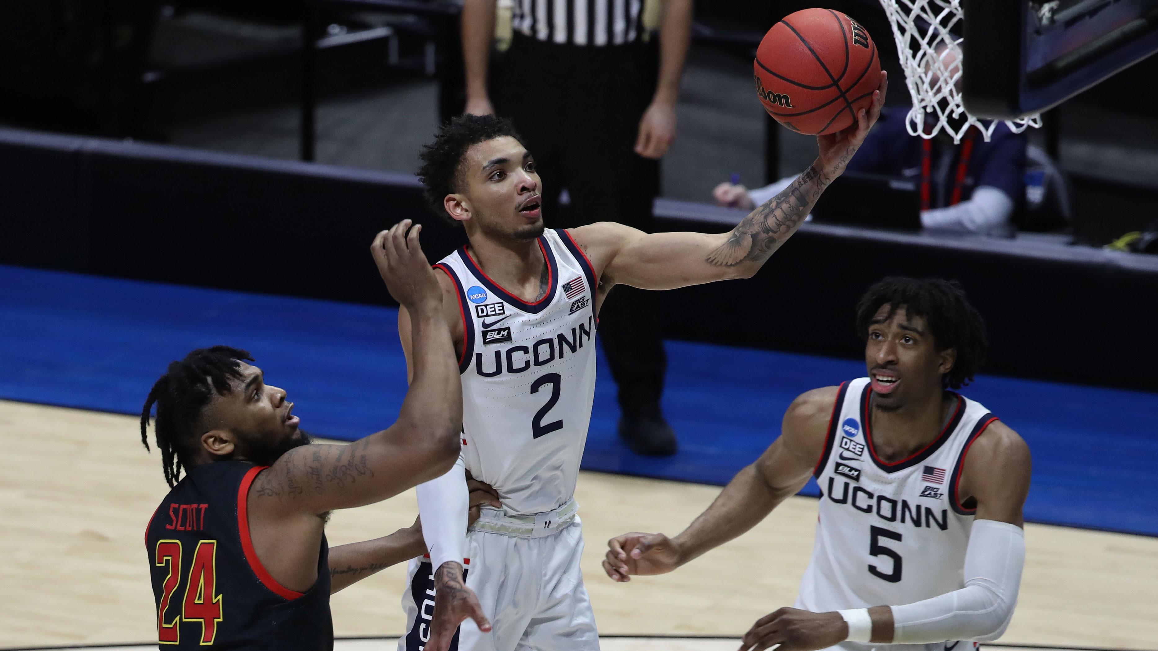 Mar 20, 2021; West Lafayette, Indiana, USA; Connecticut Huskies guard James Bouknight (2) shoots the ball over Maryland Terrapins forward Donta Scott (24) as Connecticut forward Isaiah Whaley (5) looks on during the second half in the first round of the 2021 NCAA Tournament at Mackey Arena. / Joshua Bickel-USA TODAY Sports