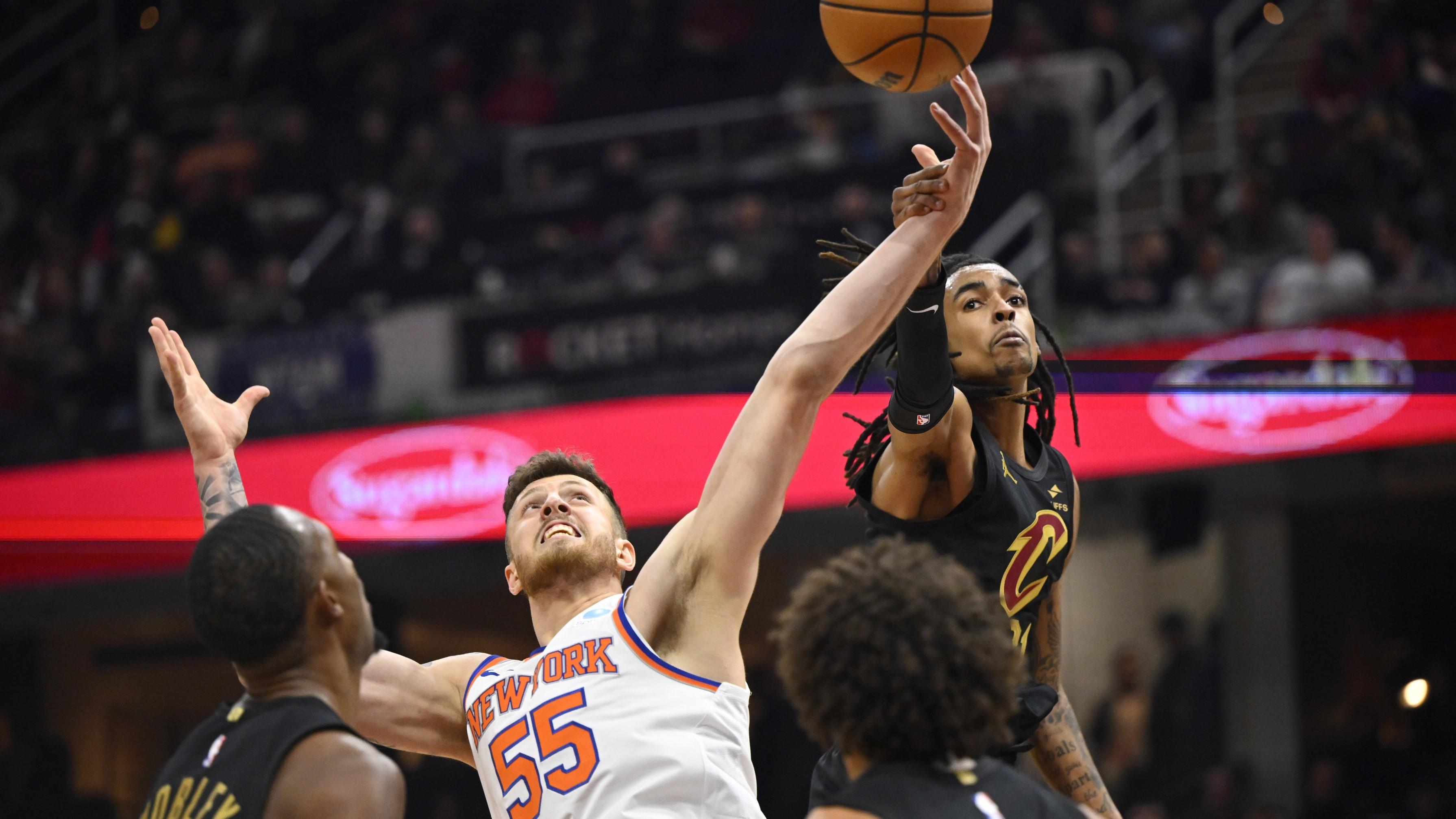 Oct 31, 2023; Cleveland, Ohio, USA; New York Knicks center Isaiah Hartenstein (55) and Cleveland Cavaliers forward Emoni Bates (21) reach for a rebound in the second quarter at Rocket Mortgage FieldHouse / David Richard-USA TODAY Sports