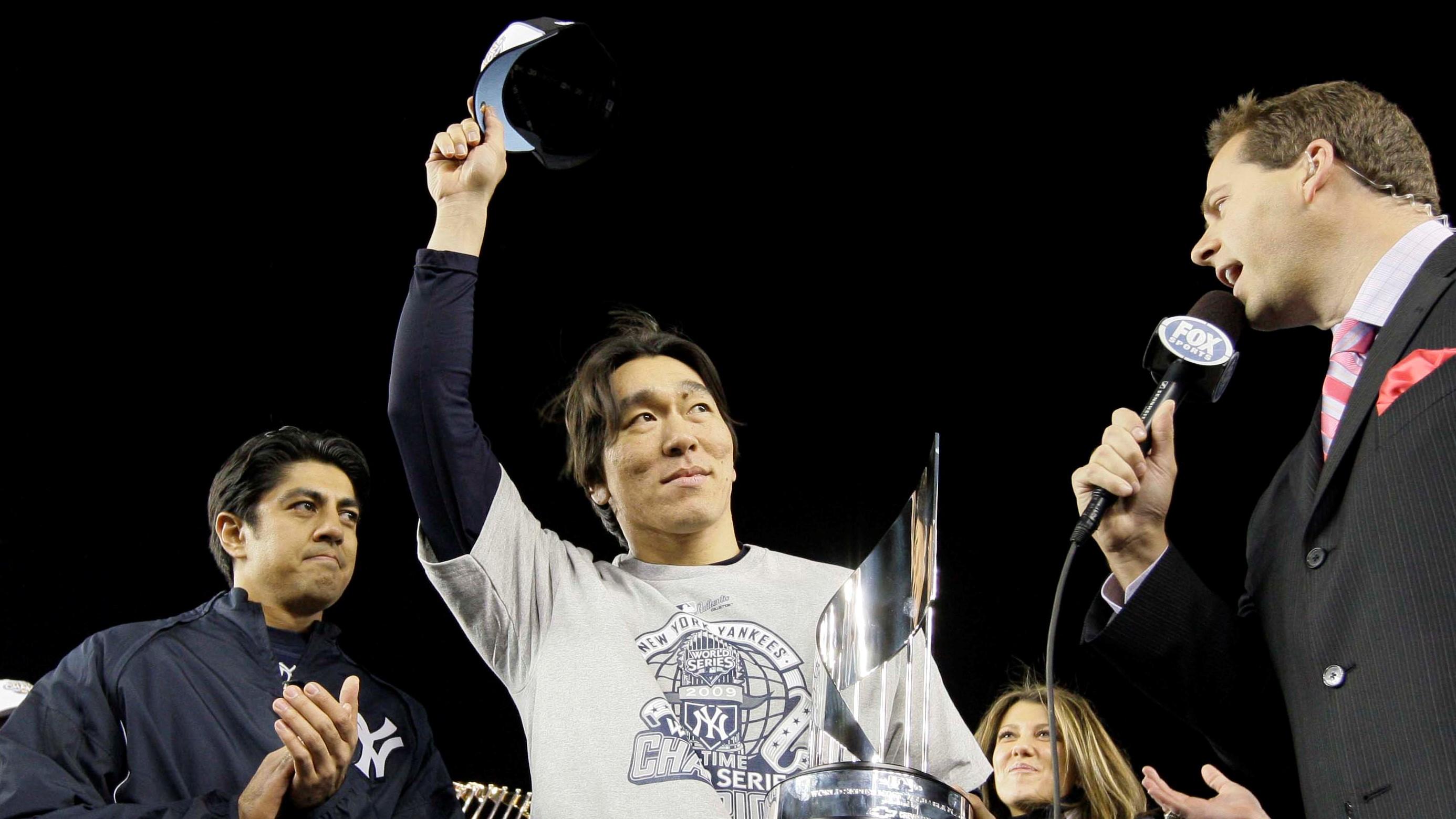 Nov 4, 2009; Bronx, NY, USA; New York Yankees designated hitter Hideki Matsui (center) waves to the crowd after being named the MVP of the World Series after defeating the Philadelphia Phillies 7-4 in game six of the 2009 World Series at Yankee Stadium. Mandatory Credit: David J. Phillip/Pool Photo via USA TODAY Sports / David J. Phillip/Pool Photo via USA TODAY Sports