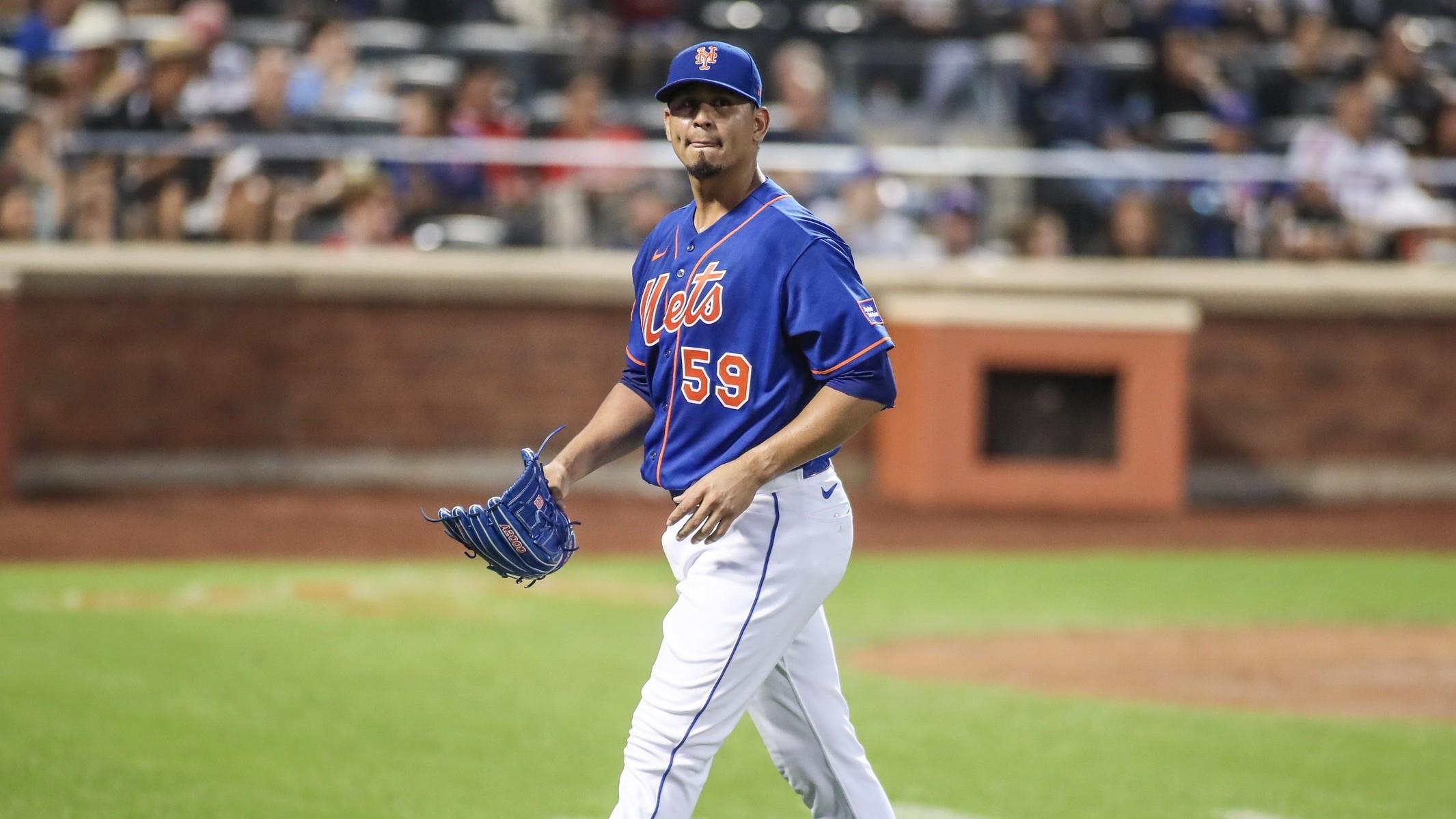 New York Mets starting pitcher Carlos Carrasco (59) walks off the field after being taken out in the second inning against the Los Angeles Angels at Citi Field. / Wendell Cruz-USA TODAY Sports