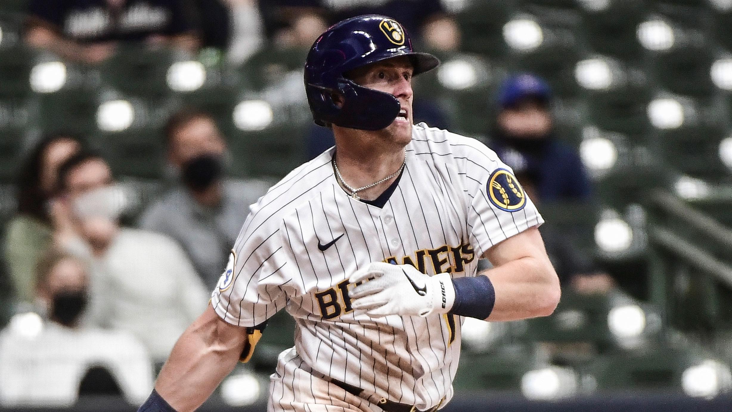 May 1, 2021; Milwaukee, Wisconsin, USA; Milwaukee Brewers right fielder Billy McKinney (11) runs to first base after hitting a single in the fourth inning during the game against the Los Angeles Dodgers at American Family Field. / Benny Sieu-USA TODAY Sports