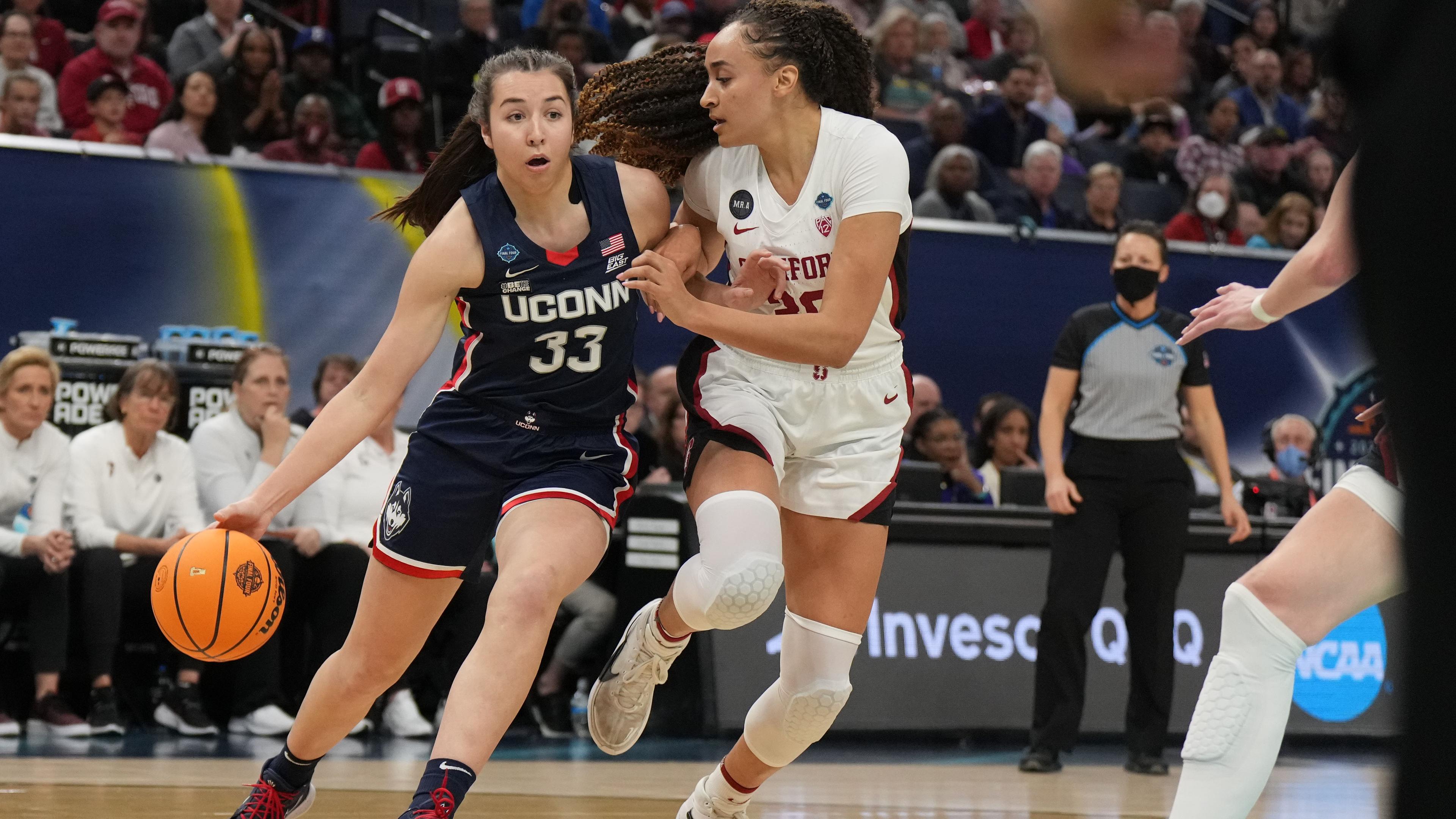Apr 1, 2022; Minneapolis, MN, USA; UConn Huskies guard Caroline Ducharme (33) dribbles the ball as Stanford Cardinal guard Haley Jones (30) defends during the first half in the Final Four semifinals of the women's college basketball NCAA Tournament at Target Center. / Kirby Lee-USA TODAY Sports