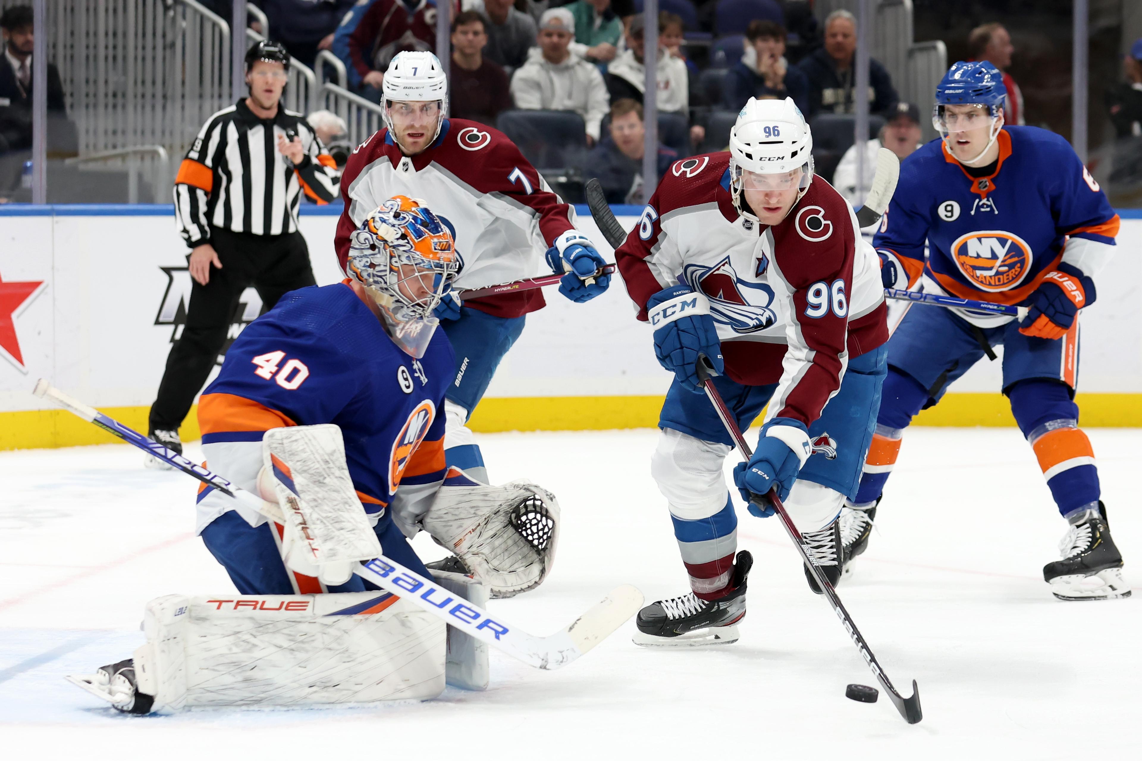 Mar 7, 2022; Elmont, New York, USA; Colorado Avalanche right wing Mikko Rantanen (96) plays the puck in front of New York Islanders goaltender Semyon Varlamov (40) during the first period at UBS Arena. Mandatory Credit: Brad Penner-USA TODAY Sports / © Brad Penner-USA TODAY Sports