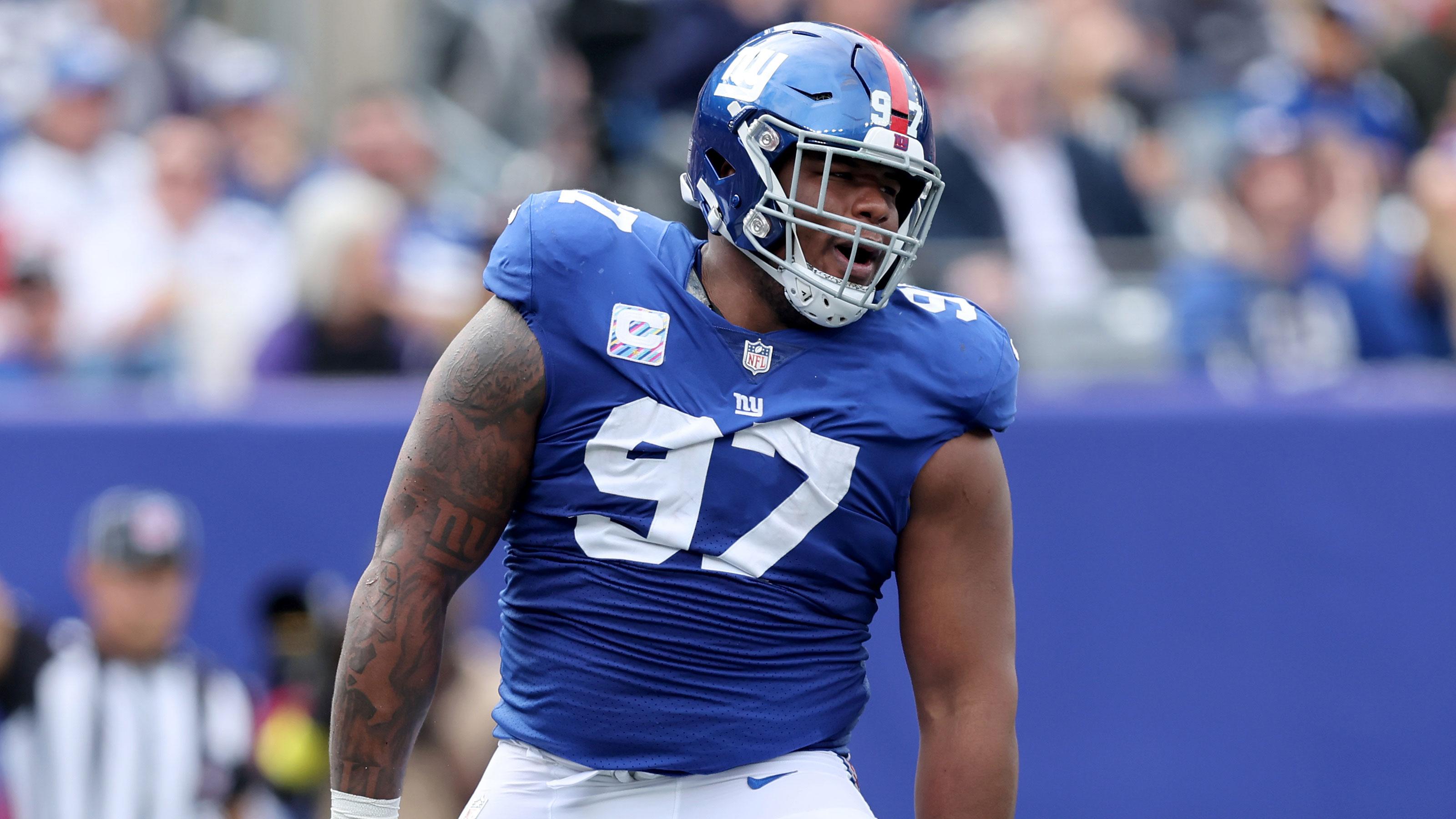 Oct 16, 2022; East Rutherford, New Jersey, USA; New York Giants defensive tackle Dexter Lawrence (97) celebrates a sack against the Baltimore Ravens during the second quarter at MetLife Stadium. / Brad Penner-USA TODAY Sports