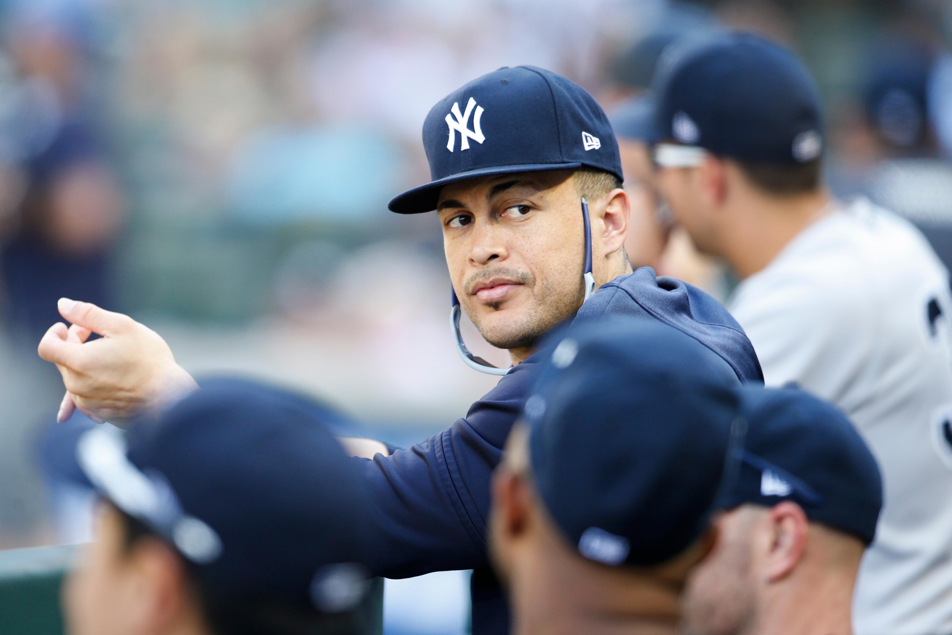 Aug 28, 2019; Seattle, WA, USA; New York Yankees outfielder Giancarlo Stanton (27) sits in the dugout during the ninth inning against the Seattle Mariners at T-Mobile Park. Mandatory Credit: Joe Nicholson-USA TODAY Sports / Joe Nicholson-USA TODAY Sports