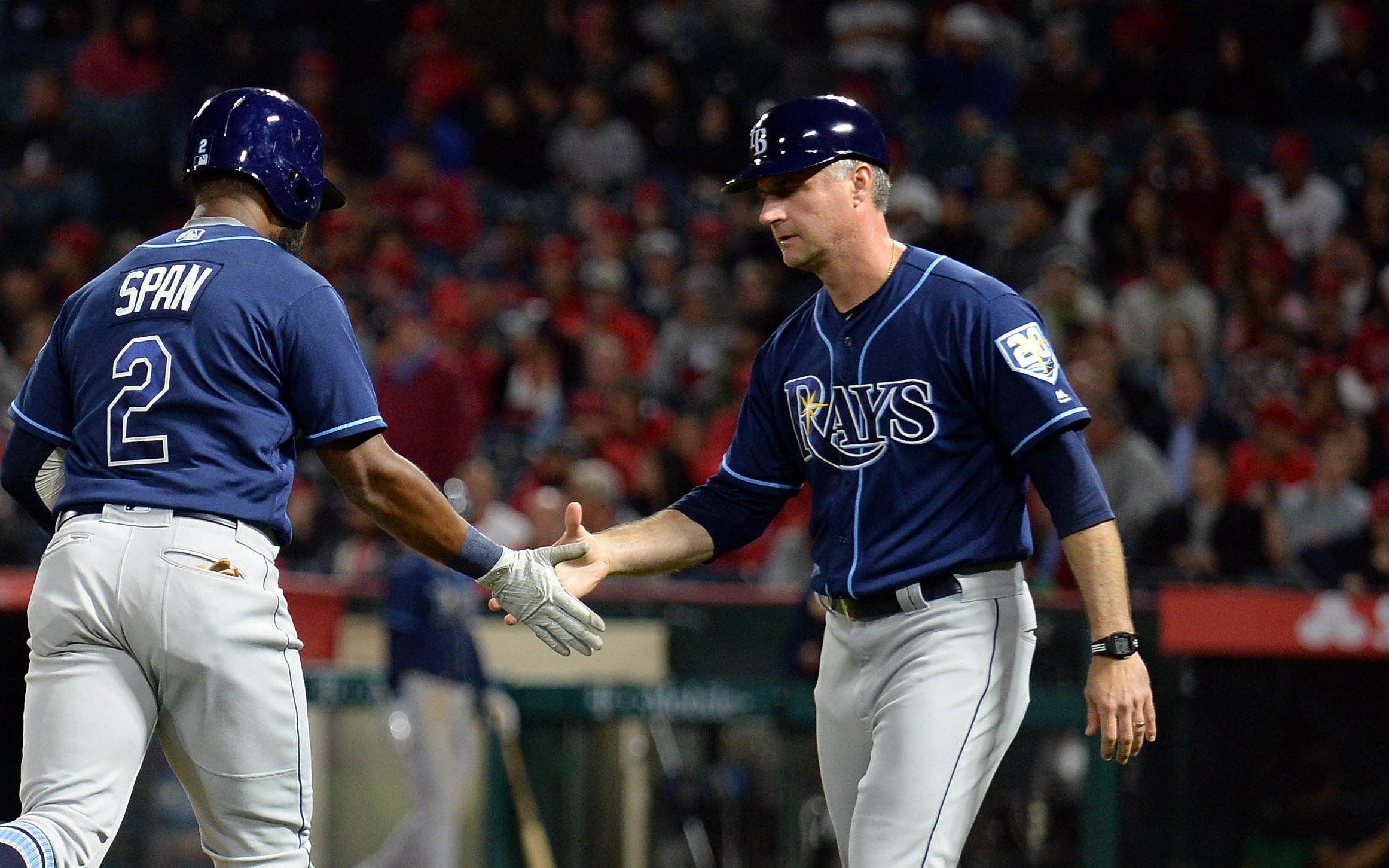 May 17, 2018; Anaheim, CA, USA; Tampa Bay Rays left fielder Denard Span (2) is greeted by third base coach Matt Quatraro (33) after hitting a two run home run in the seventh inning against the Los Angeles Angels at Angel Stadium of Anaheim. Mandatory Credit: Gary A. Vasquez-USA TODAY Sports / © Gary A. Vasquez-USA TODAY Sports
