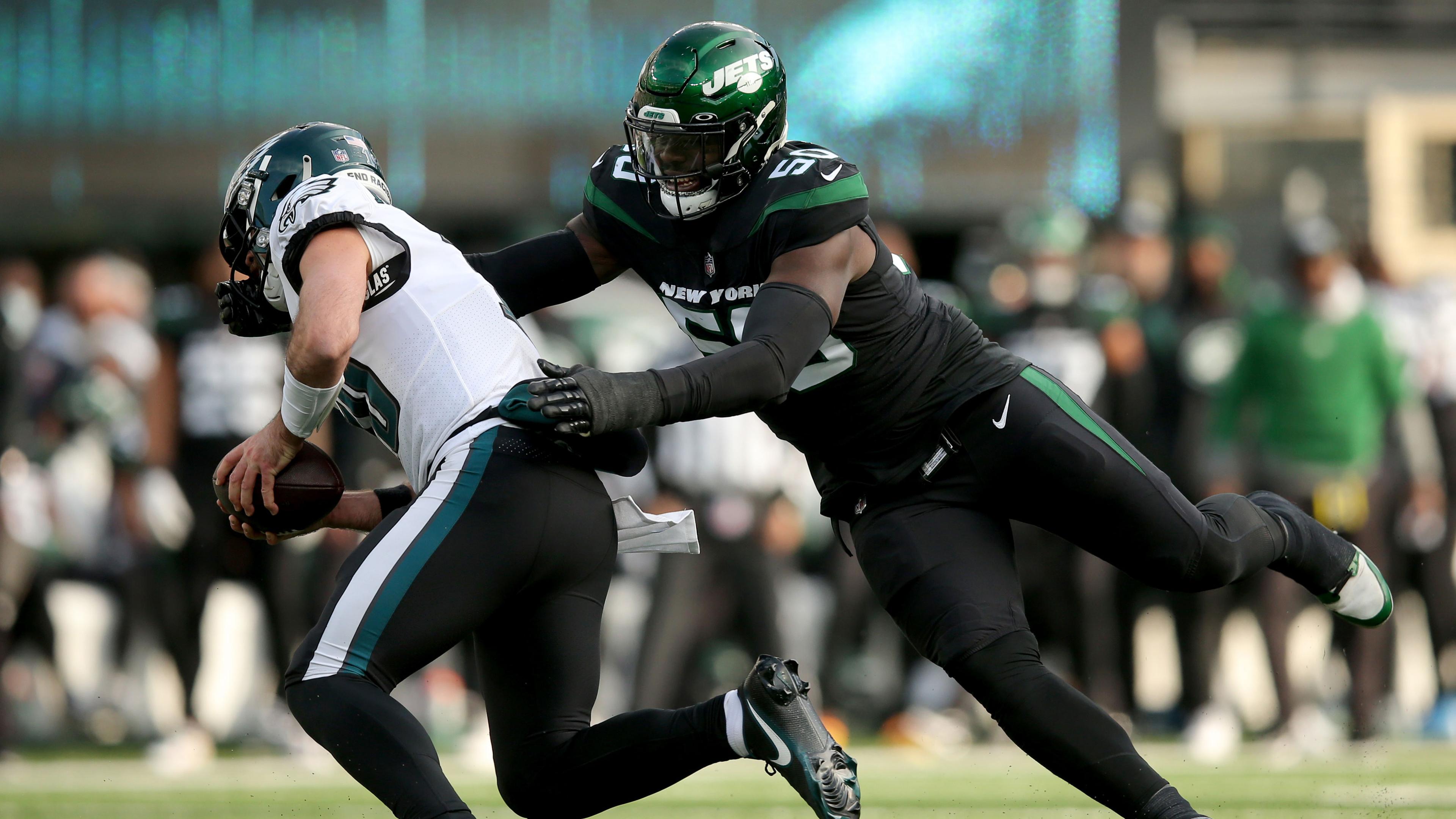 Dec 5, 2021; East Rutherford, New Jersey, USA; Philadelphia Eagles quarterback Gardner Minshew (10) is sacked by New York Jets defensive end Shaq Lawson (50) during the second quarter at MetLife Stadium. Lawson was called for a facemask penalty on the play. / Brad Penner-USA TODAY Sports