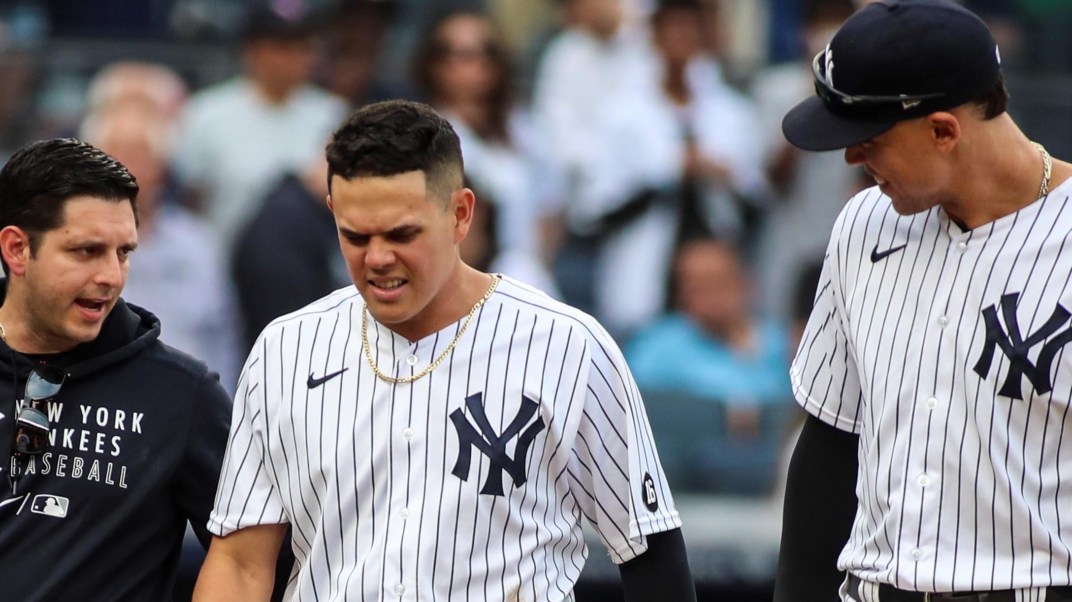 Oct 3, 2021; Bronx, New York, USA; New York Yankees shortstop Gio Urshela (29) walks back into the dugout with right fielder Aaron Judge (99) after falling into the dugout of the Tampa Bay Rays to make the the third out in the sixth inning at Yankee Stadium. Mandatory Credit: Wendell Cruz-USA TODAY Sports / Wendell Cruz-USA TODAY Sports