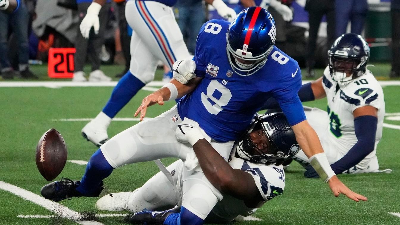 Seattle Seahawks defensive end Mario Edwards Jr. (97) strips the ball from New York Giants quarterback Daniel Jones (8) and the Seahawks recovered. / Robert Deutsch-USA TODAY Sports