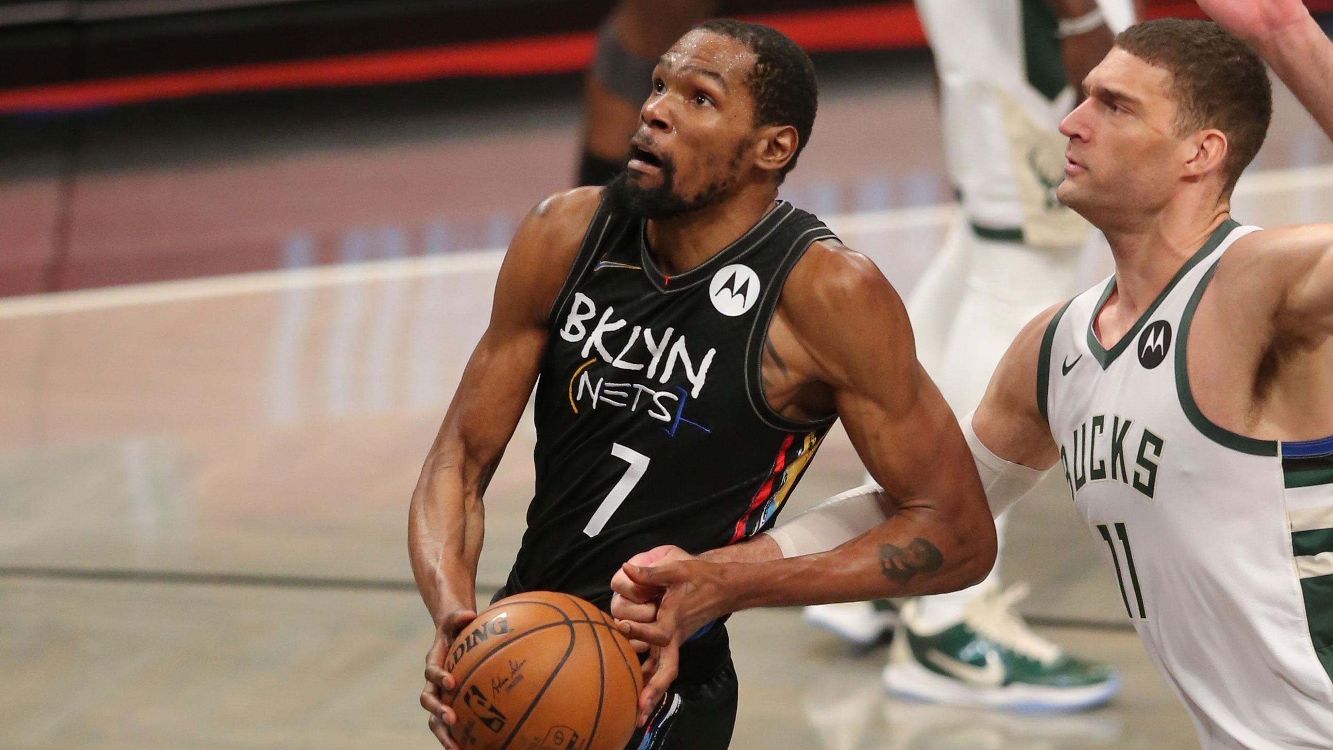 Jun 15, 2021; Brooklyn, New York, USA; Brooklyn Nets power forward Kevin Durant (7) drives to the basket against Milwaukee Bucks center Brook Lopez (11) during the third quarter of game five of the second round of the 2021 NBA Playoffs at Barclays Center. / Brad Penner-USA TODAY Sports